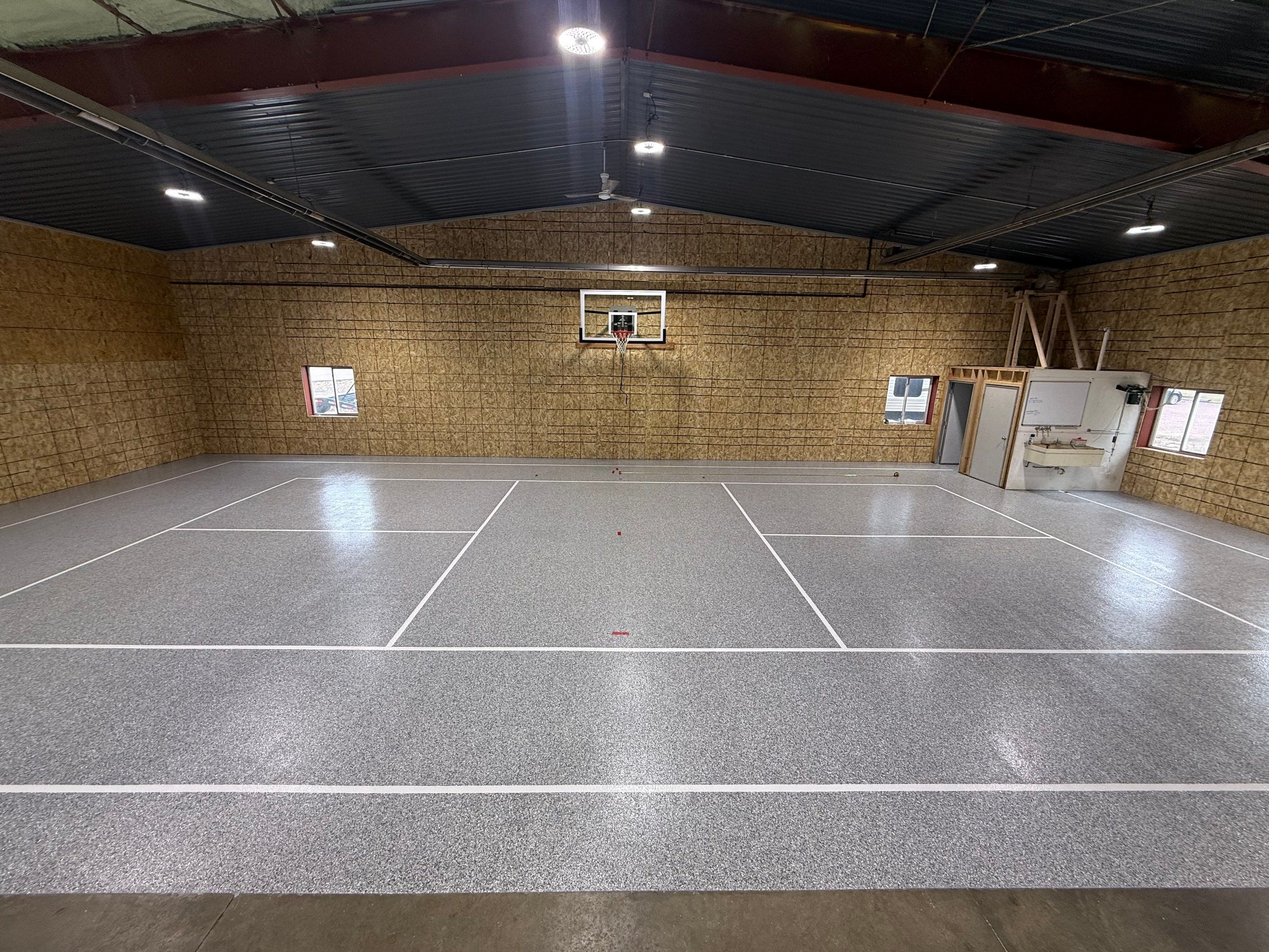 Custom Polyurea Shop Floor with Basketball Court Lines in Rock Valley by Select Painting, Coatings & Garage Cabinets