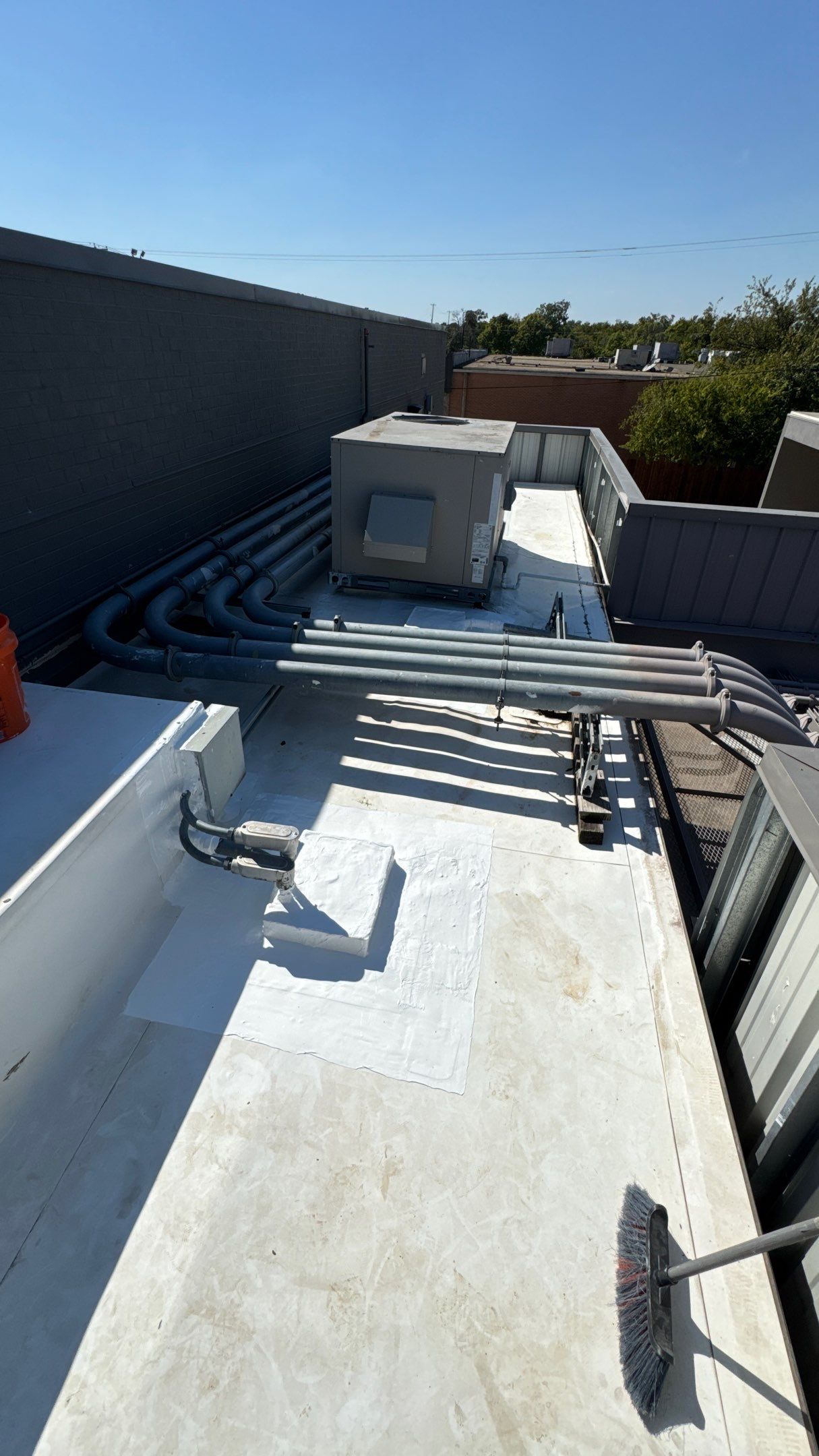 Commercial Roofing Repair using TRP #924 Eterna-Sil Premium Silicone Roof Coating by Harvey Roofing & Construction