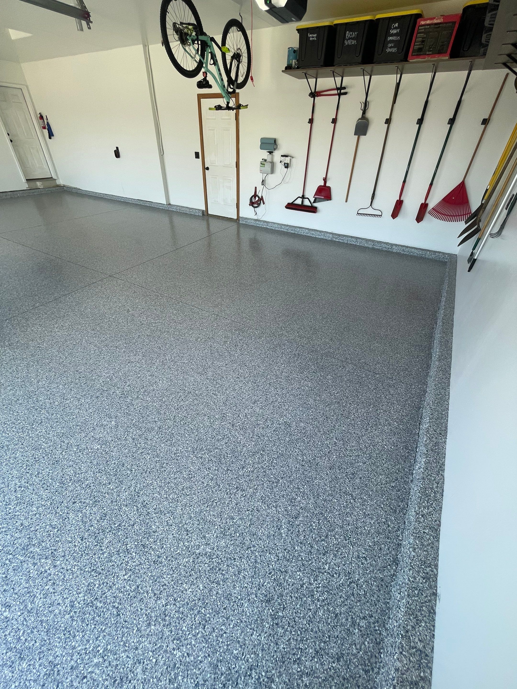 Tidal Wave Flake Garage Floor Installation in Sioux Falls by Select Painting, Coatings & Garage Cabinets