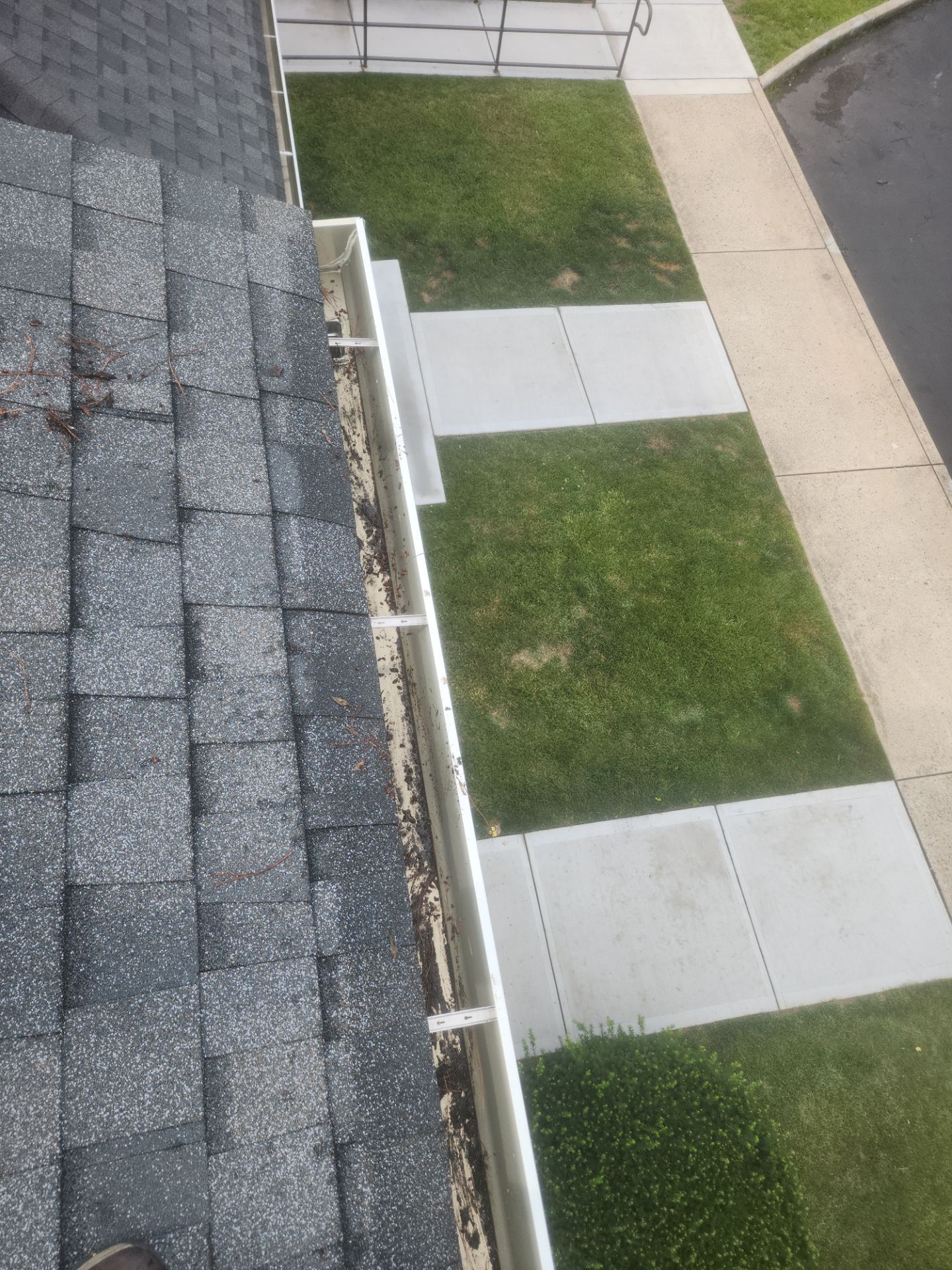 HOA gutter cleaning in Hagerstown, MD, after  photo showing full gutters.