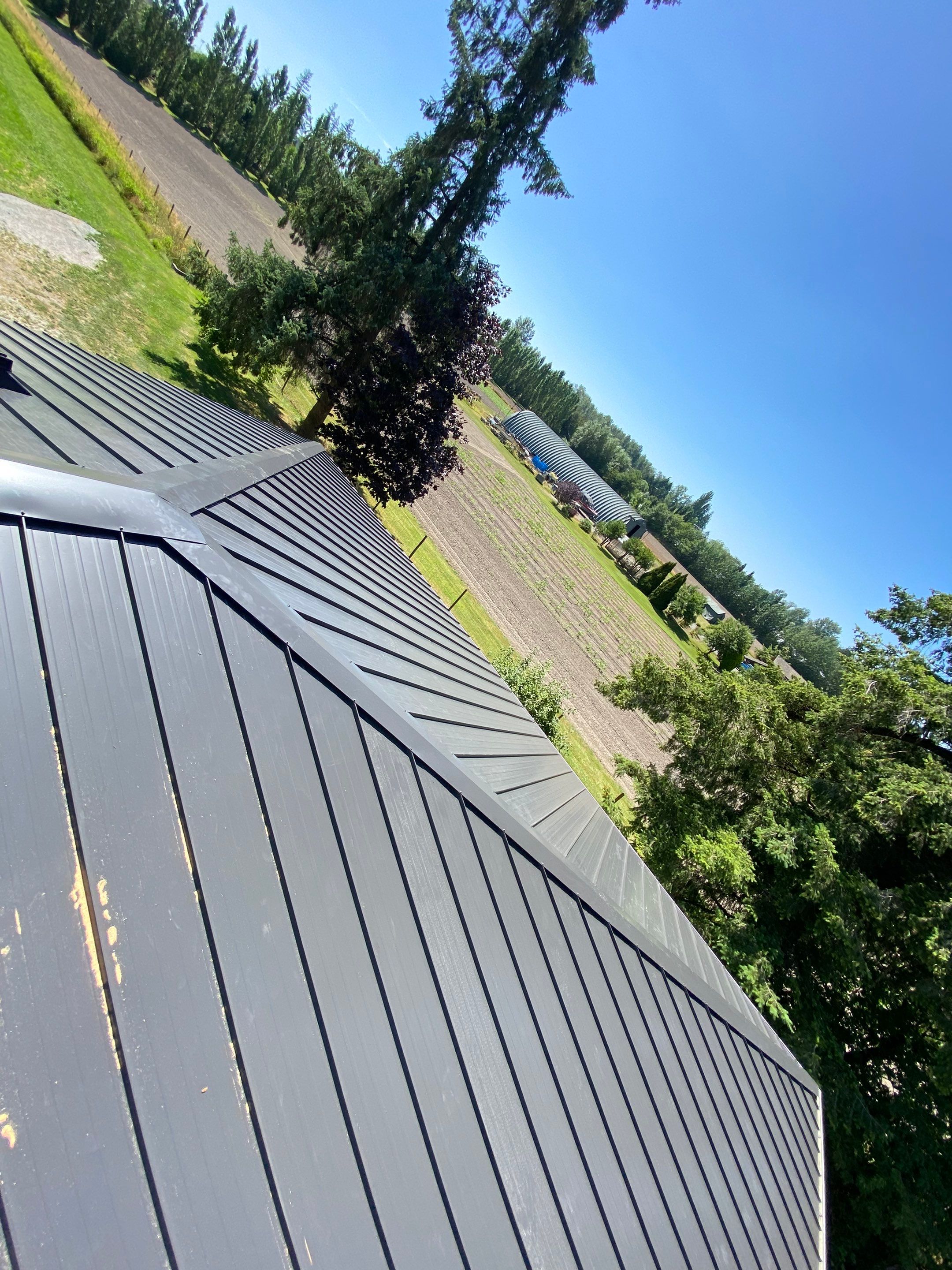Residential Roofing Installation using 12" Prolok metal  by Top Notch Roofing Inc