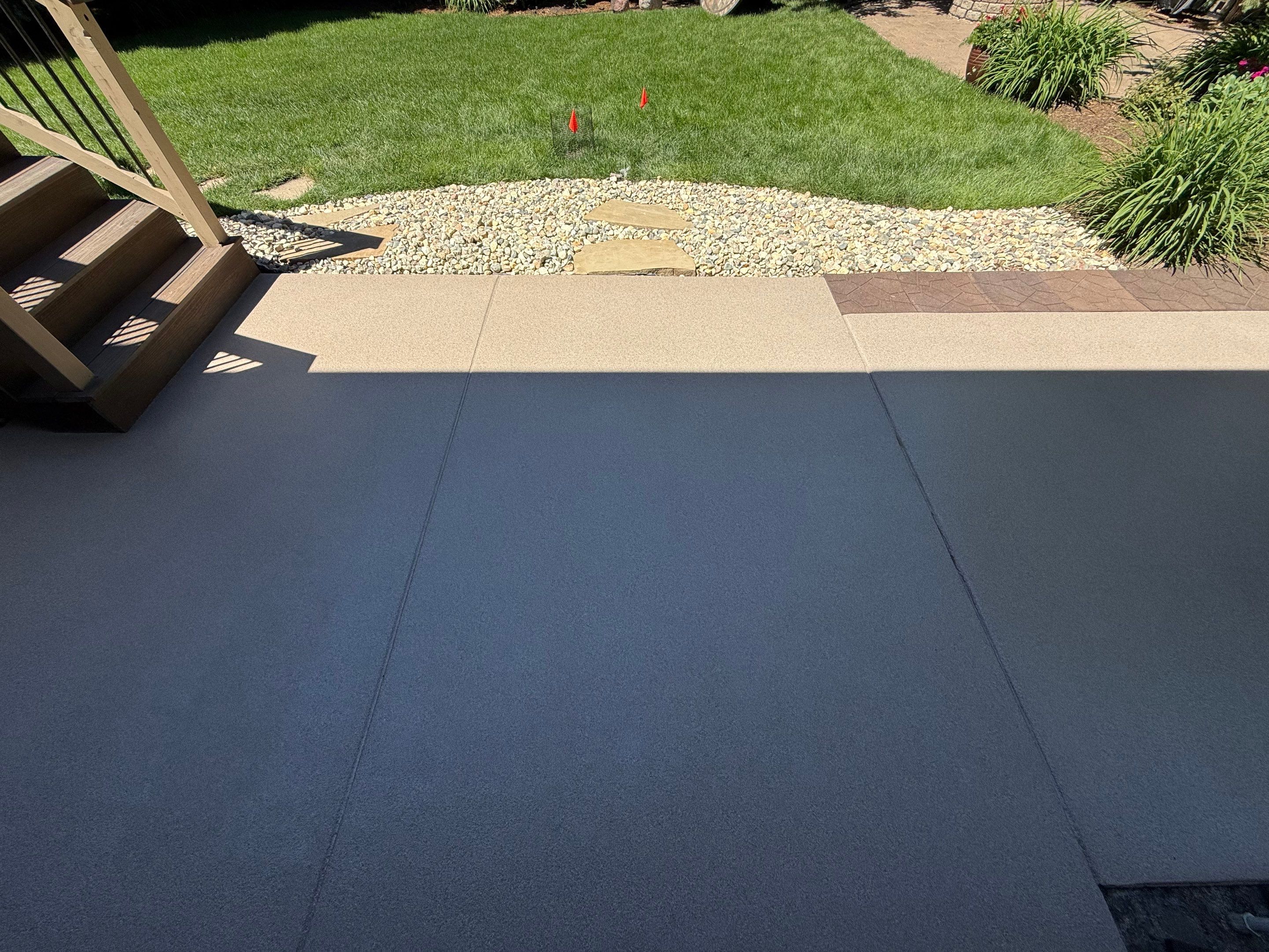 Textured Concrete Coating and Paver Patio Refresh in Sioux Falls by Select Painting, Coatings & Garage Cabinets