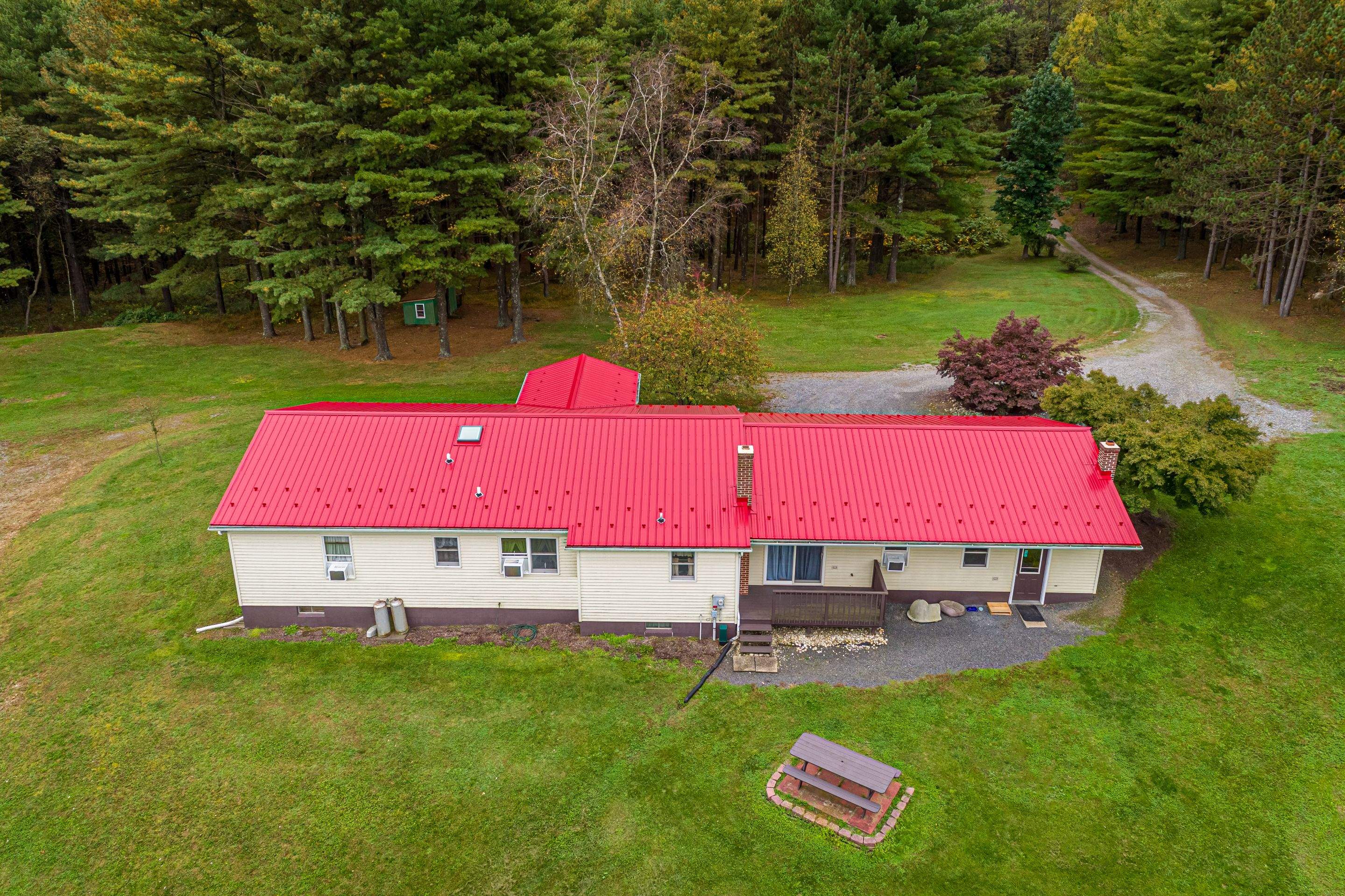 Metal Roof-scarlet red by Esh Builders