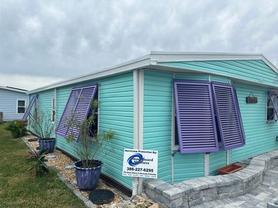 Hurricane Rated Bahama Shutters in Pearl Violet