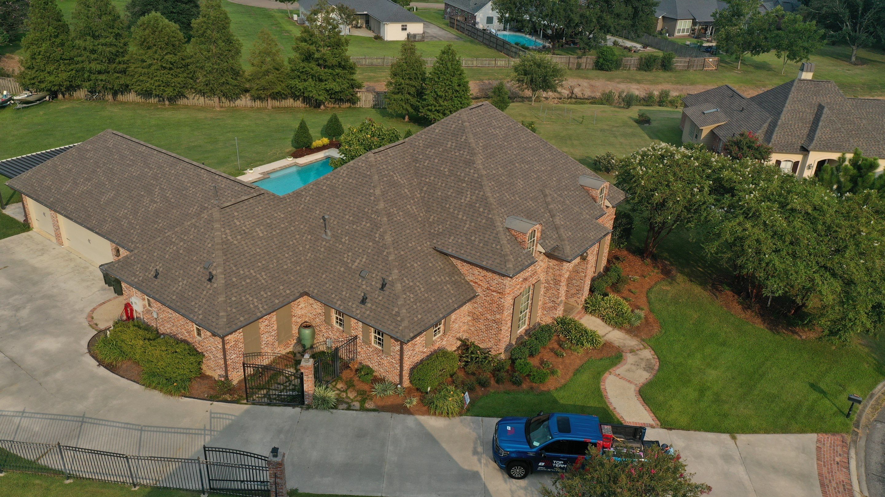 Residential Roofing Installation using Atlas Pinnacle Impact Weathered Wood; Weathered Bronze Gutters  by Top Team Construction