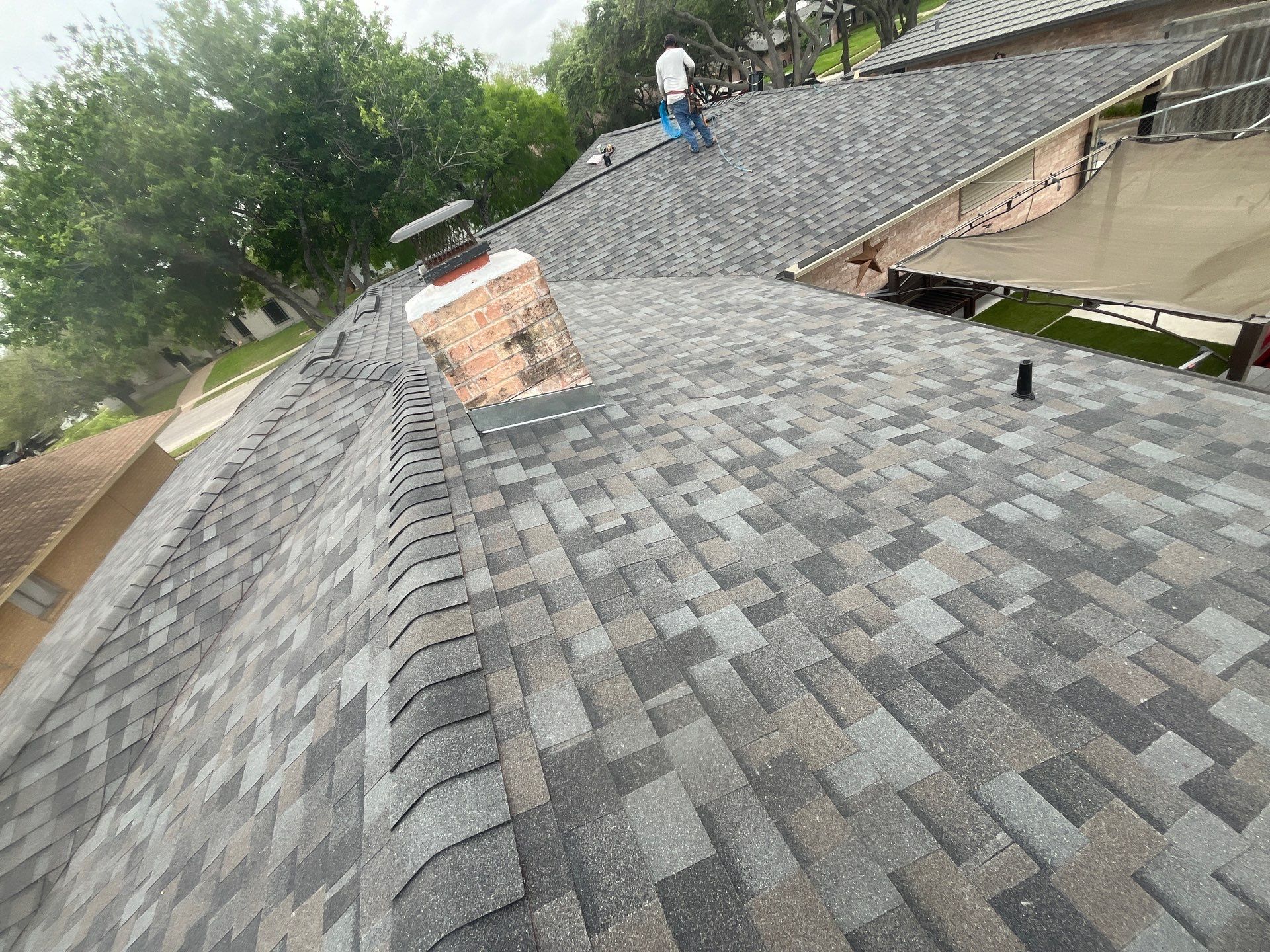 Colored Vinyl Windows to blend into brick by Bayfront Roofing and Construction