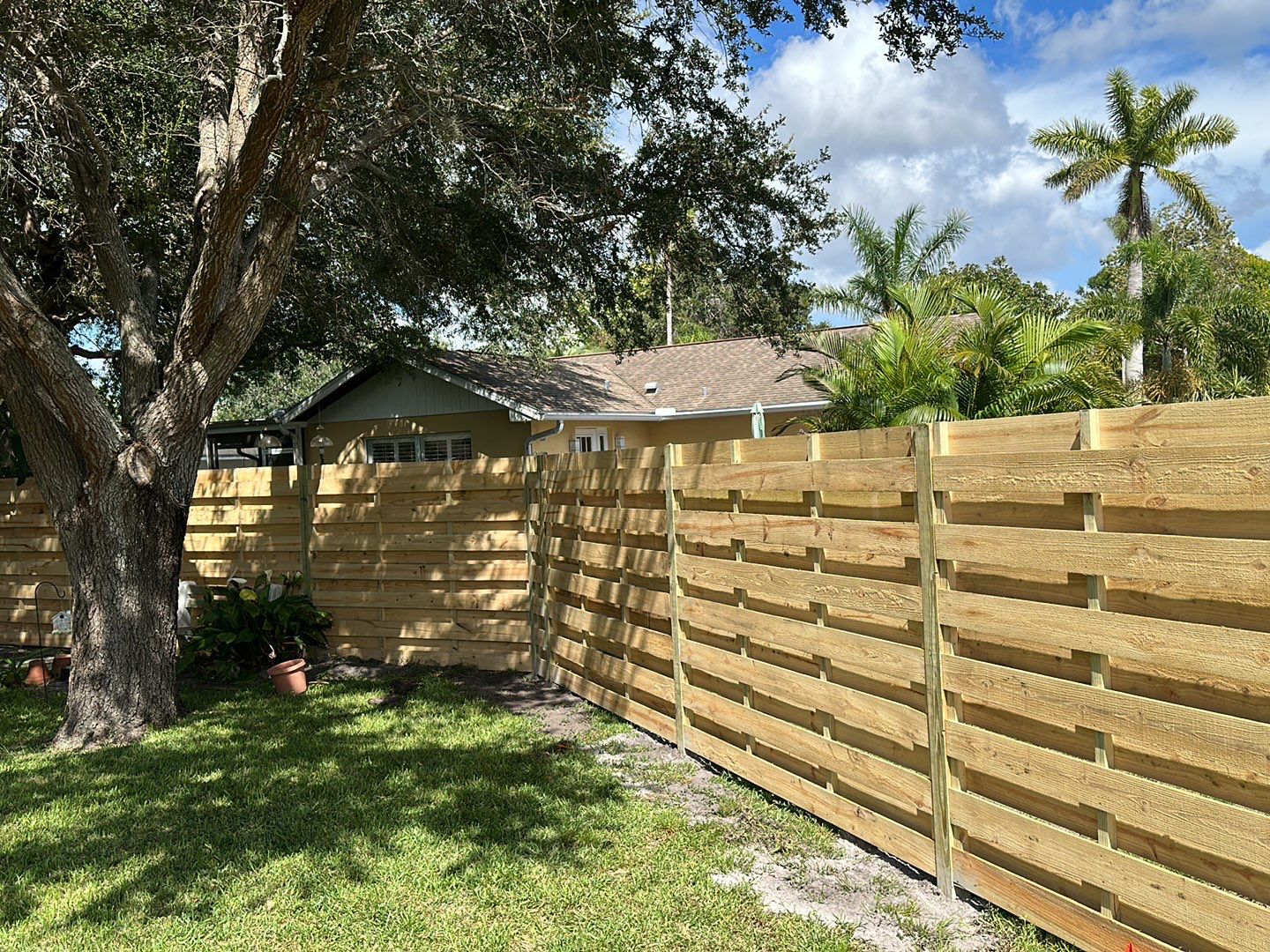 Wood Fence Installation using Horizontal Shadowbox Wood Privacy Fence by Asap fence and gates, LLC