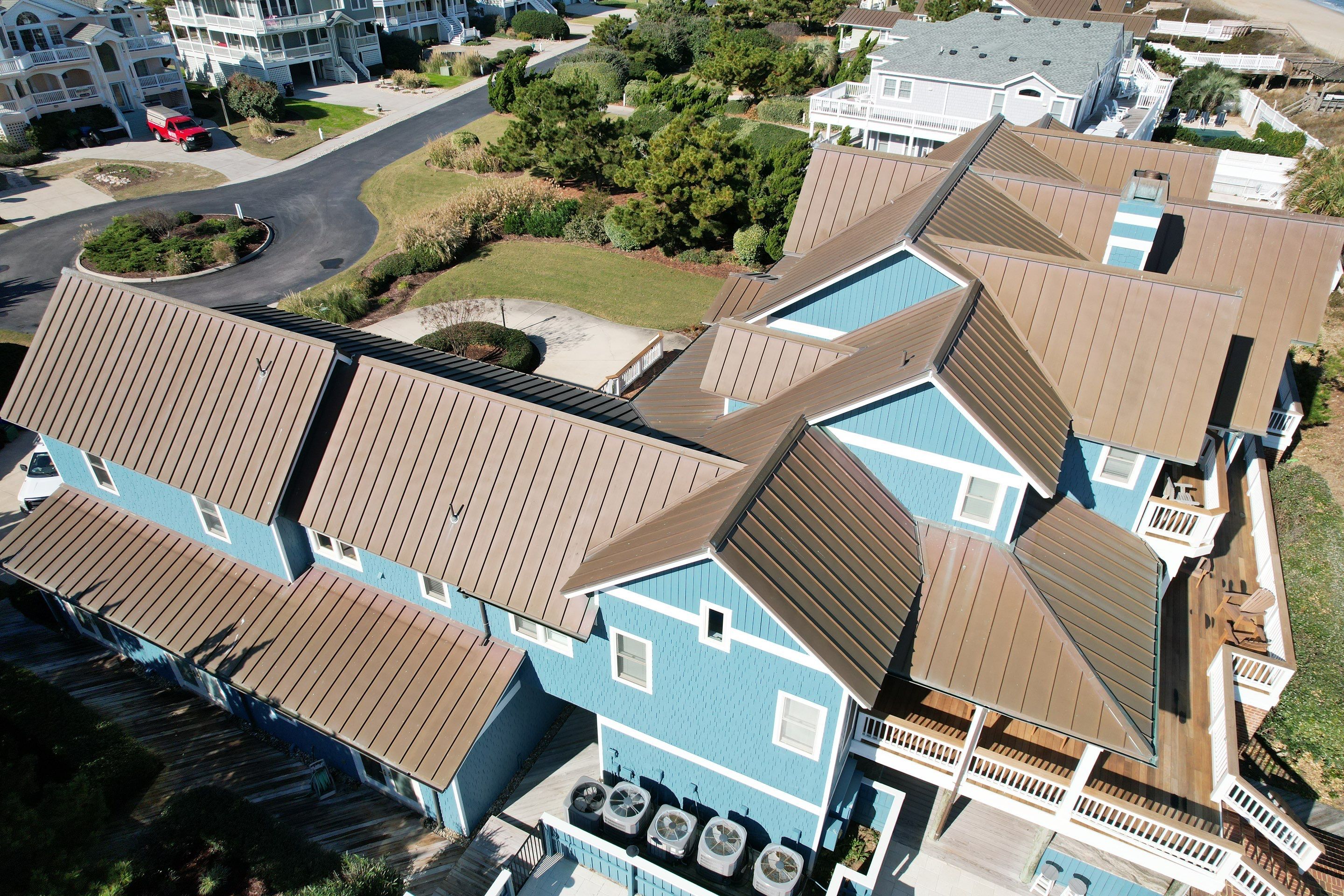 Large Metal Roof Transformation by Gallop Roofing & Remodeling, Inc.