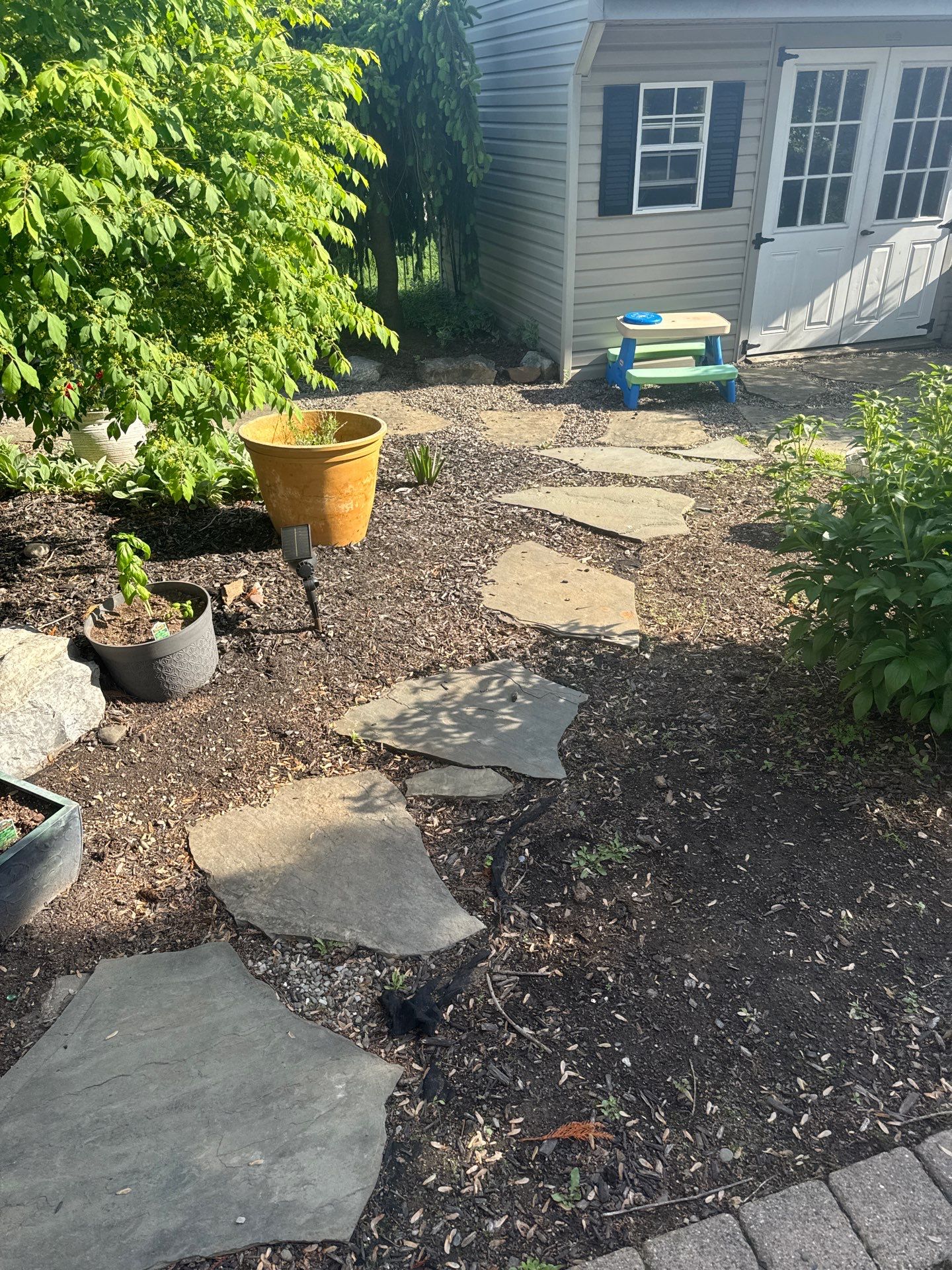 Backyard Retreat: Techo-Bloc Patio + Firepit Lounge by Saylor’s Lawn & Landscape