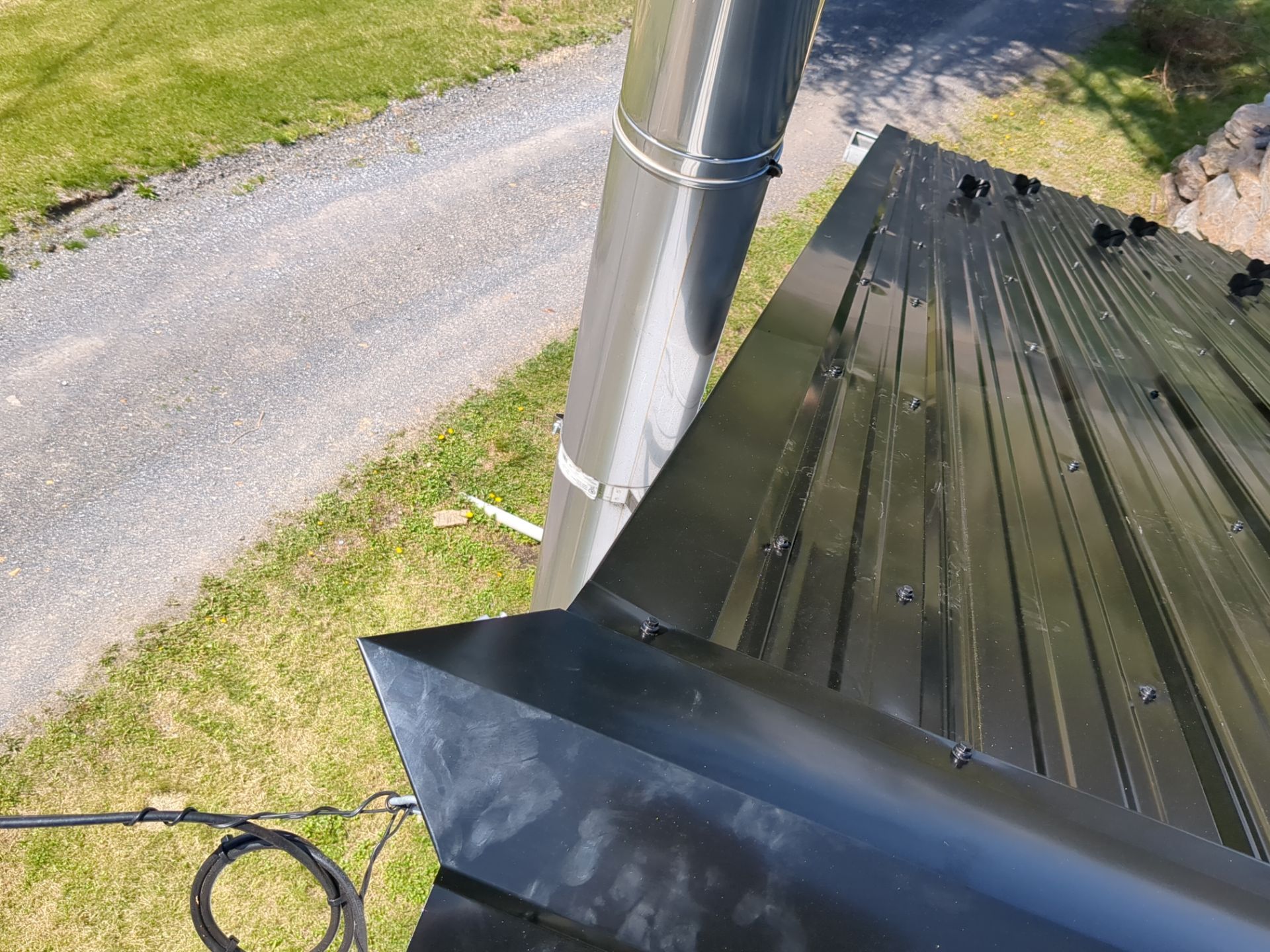 Black ABM Metal Roof Replacement  by Esh Builders