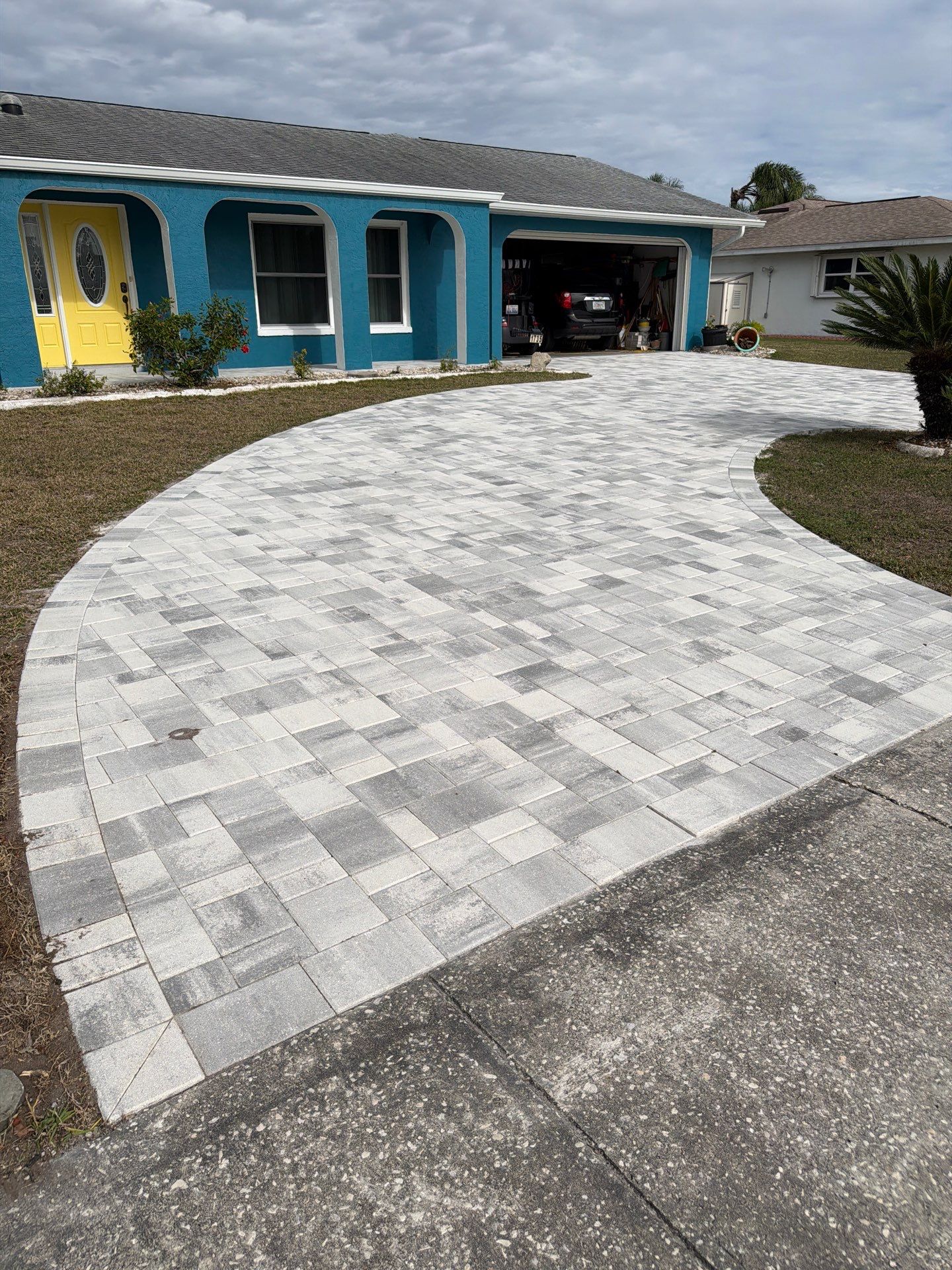 Modern Gray Paver Driveway and Entryway Walkway in Sun City Center by Supreme Paver Experts