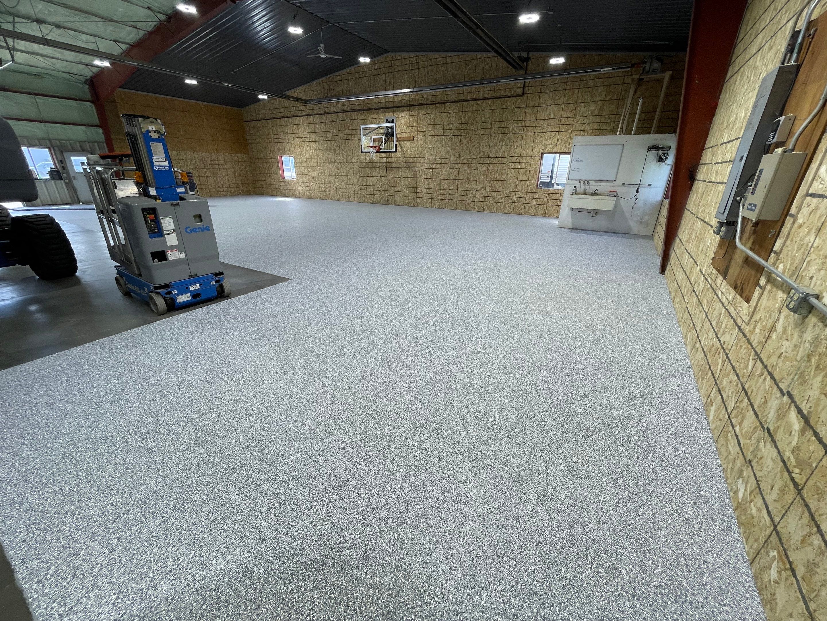 Custom Polyurea Shop Floor with Basketball Court Lines in Rock Valley by Select Painting, Coatings & Garage Cabinets
