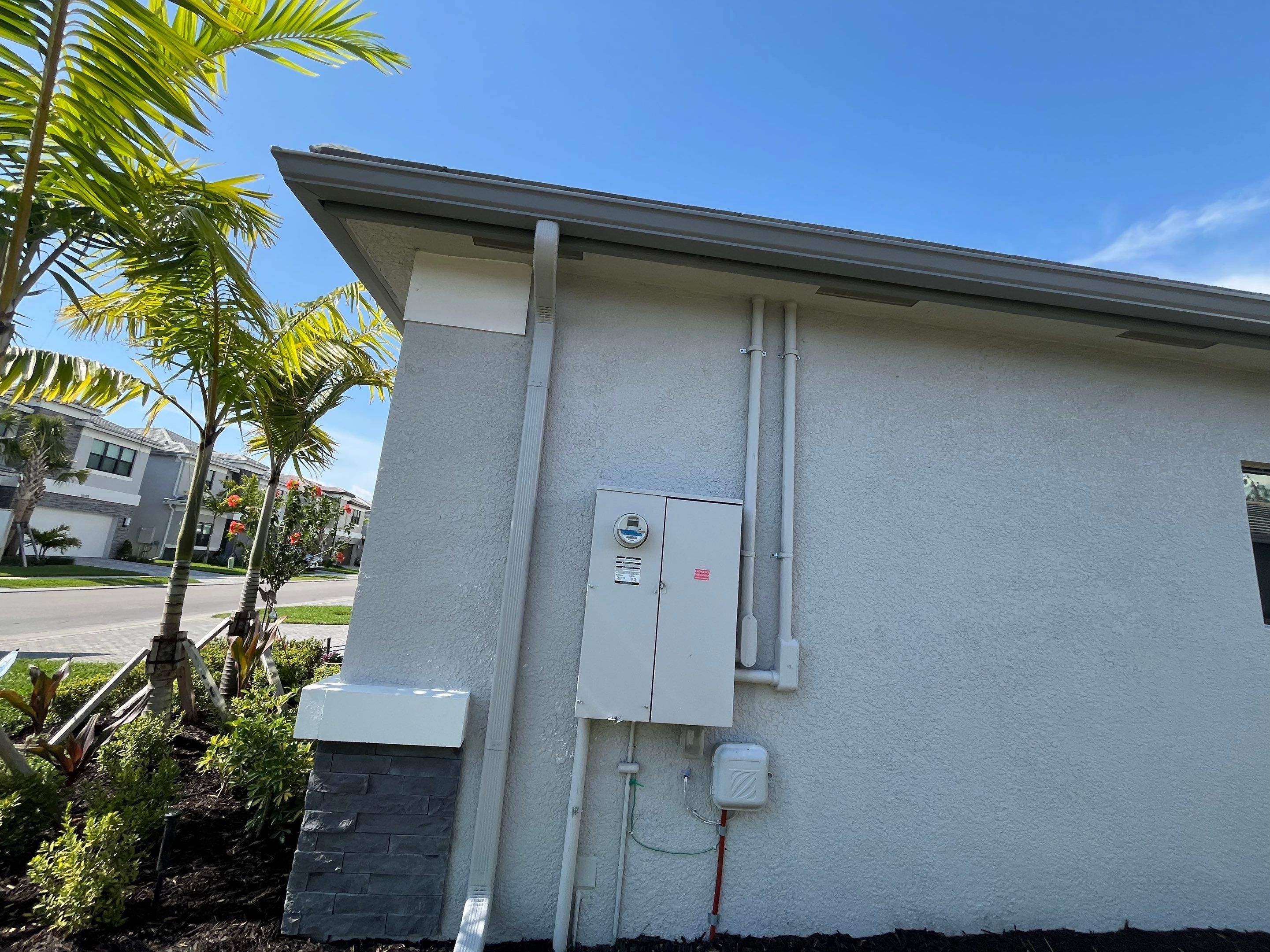 Grey Seamless Gutter Installation in Estero FL by Gutter Professors