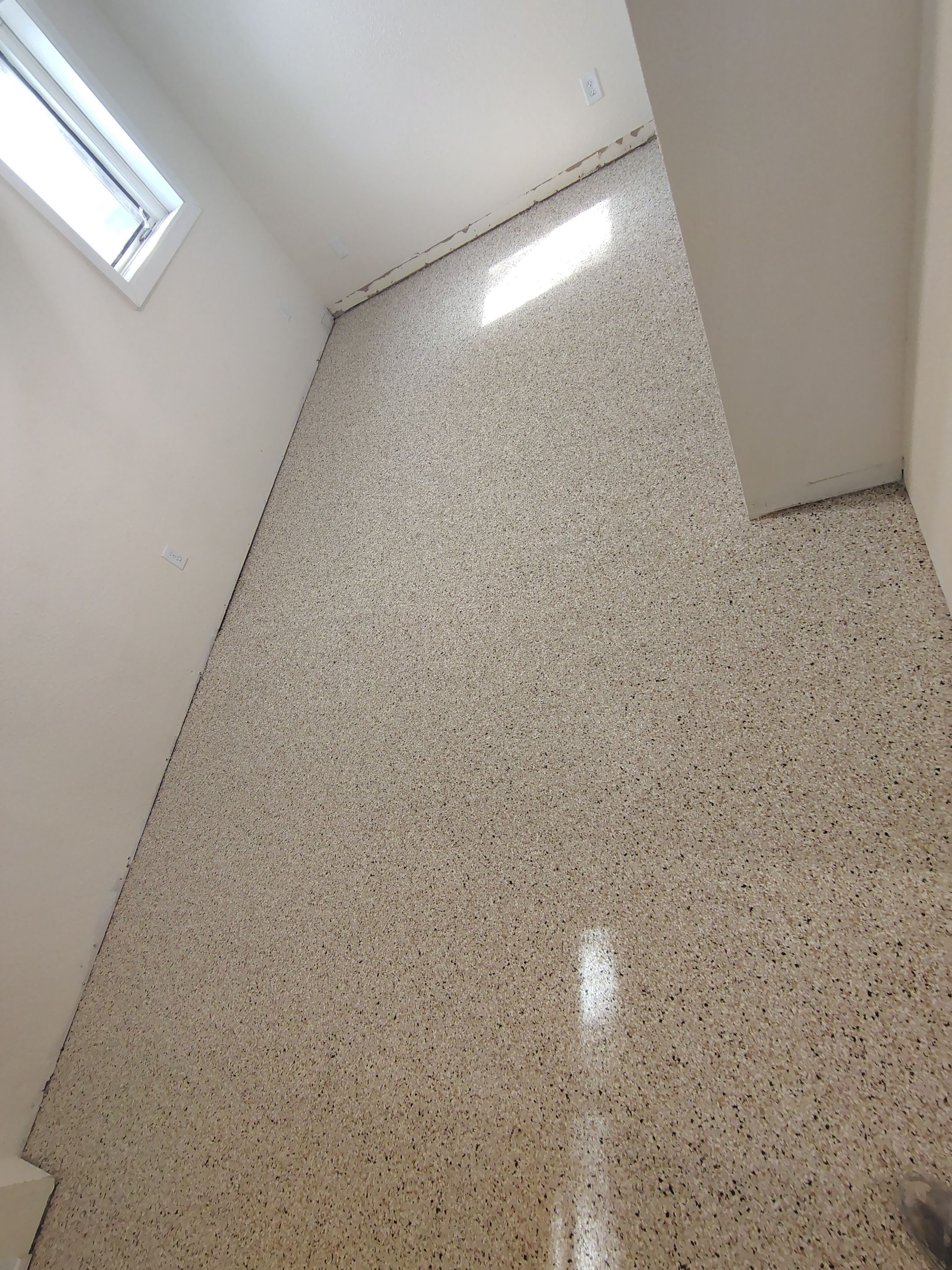 Comprehensive Basement Concrete Floor Coating and Crack Repair in Sioux Falls by Select Painting, Coatings & Garage Cabinets