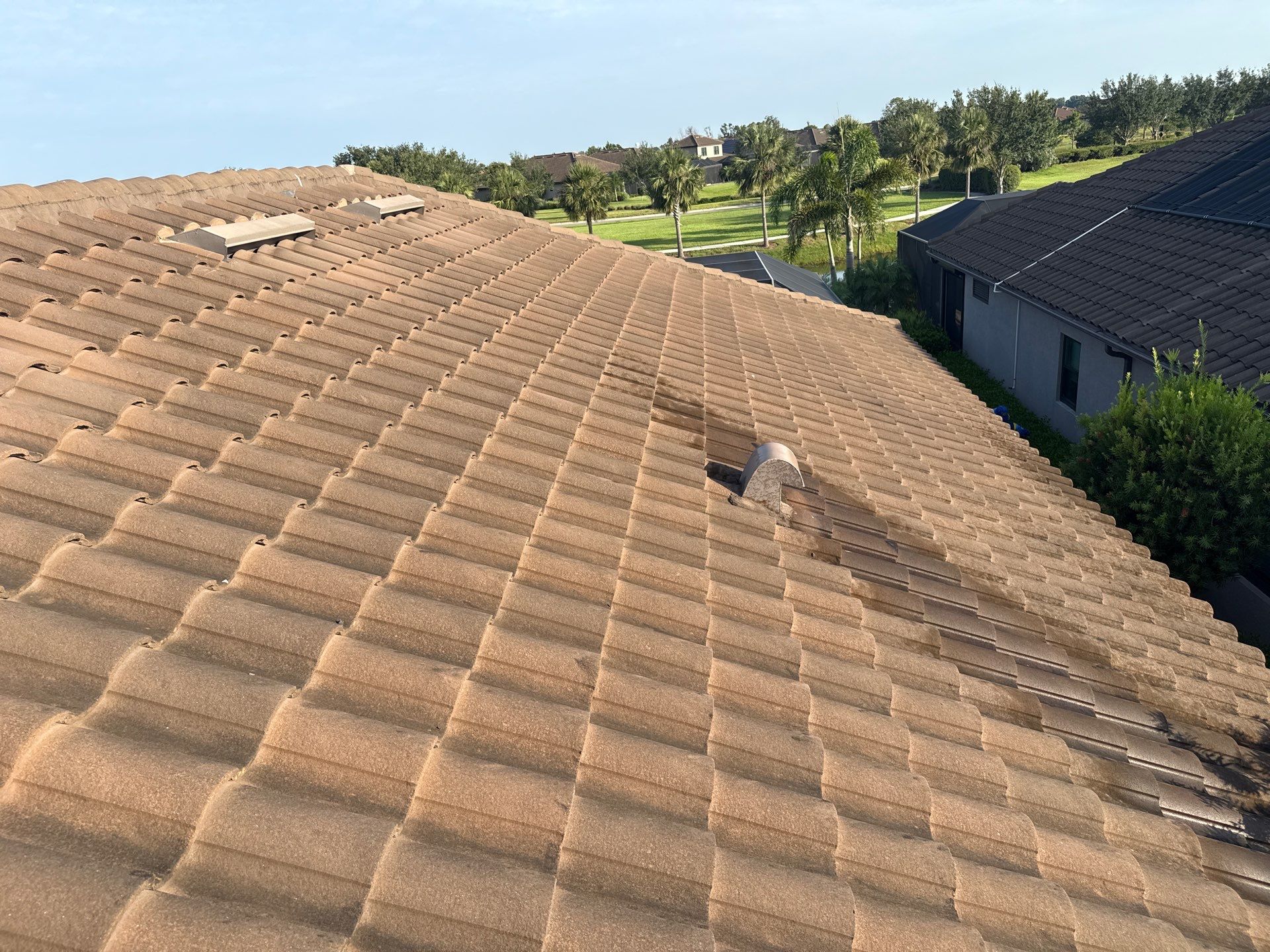 Soft Wash Roof Cleaning – Concrete Tile Roof | Artisan Lakes Esplanade, Palmetto, FL by Sunshine AquaWash