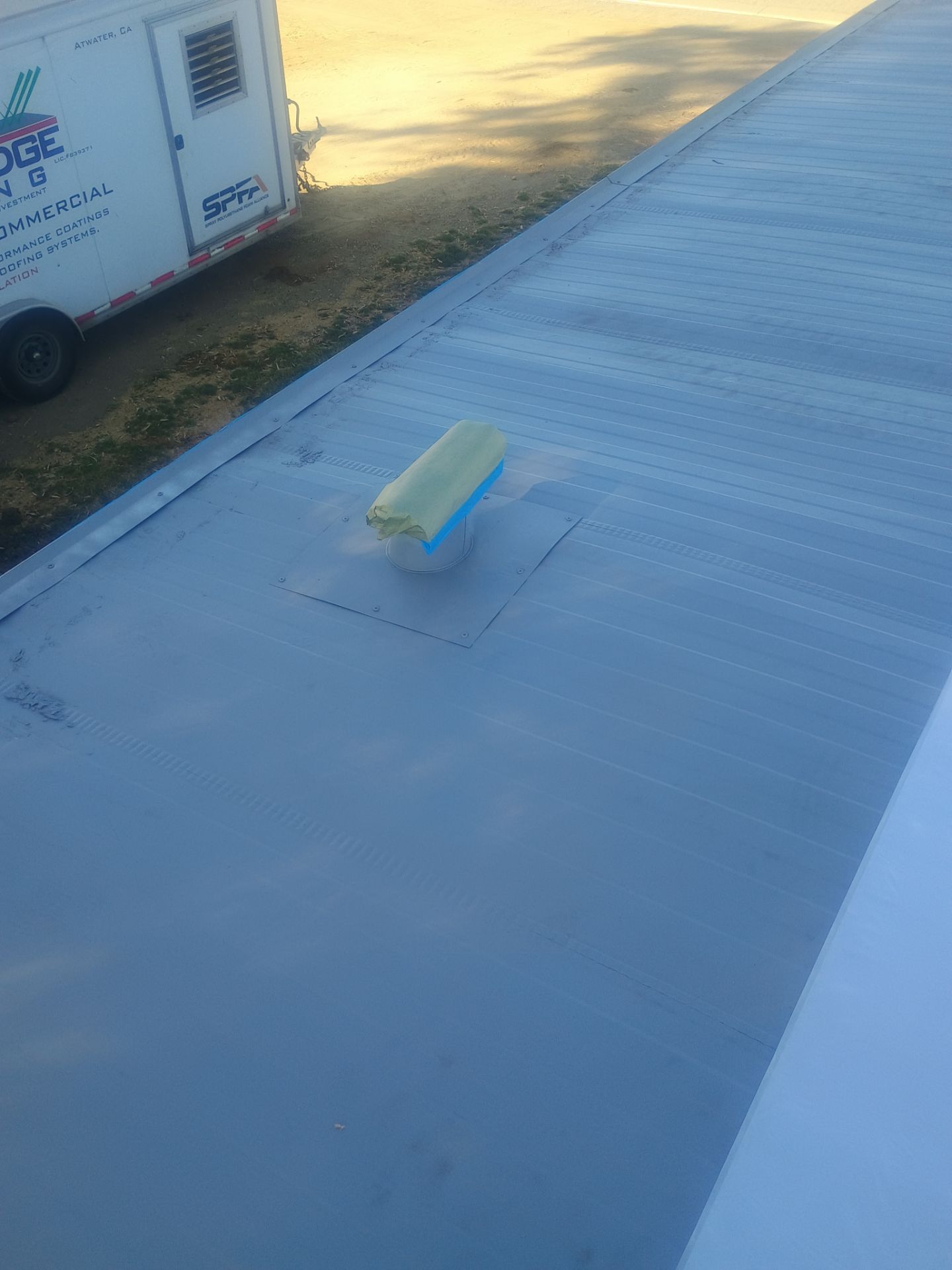 Foam and coatings on mobile home by Straight Edge Roofing Inc