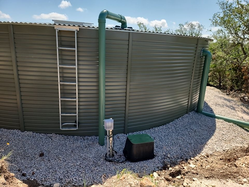 Residential Rainwater Collection System - Pioneer 40K gallon water tank in Mangrove Green by Hill Country Rain Water