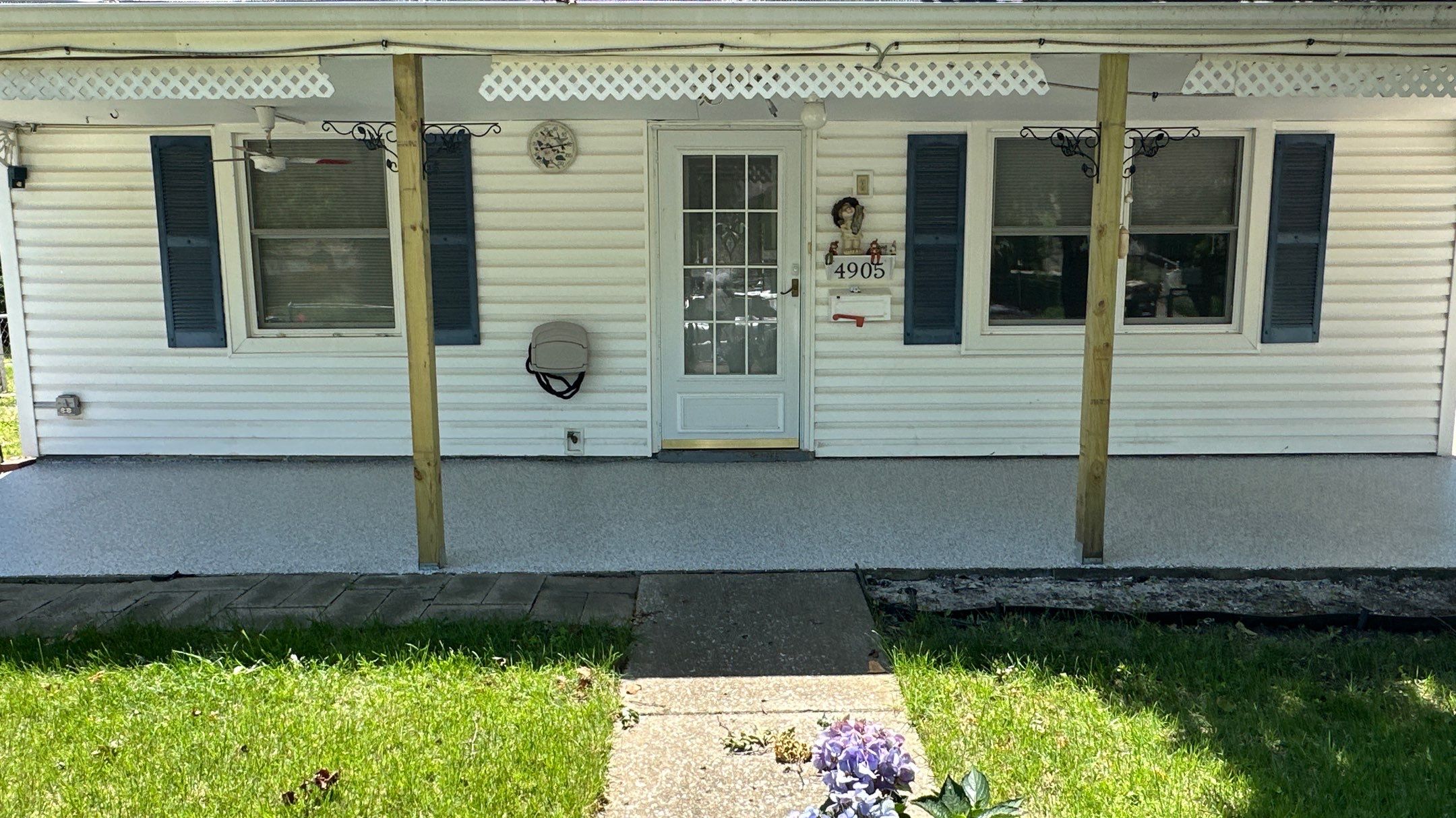 Look at this beautiful Coyote flake floor on this patio by Banner Garage
