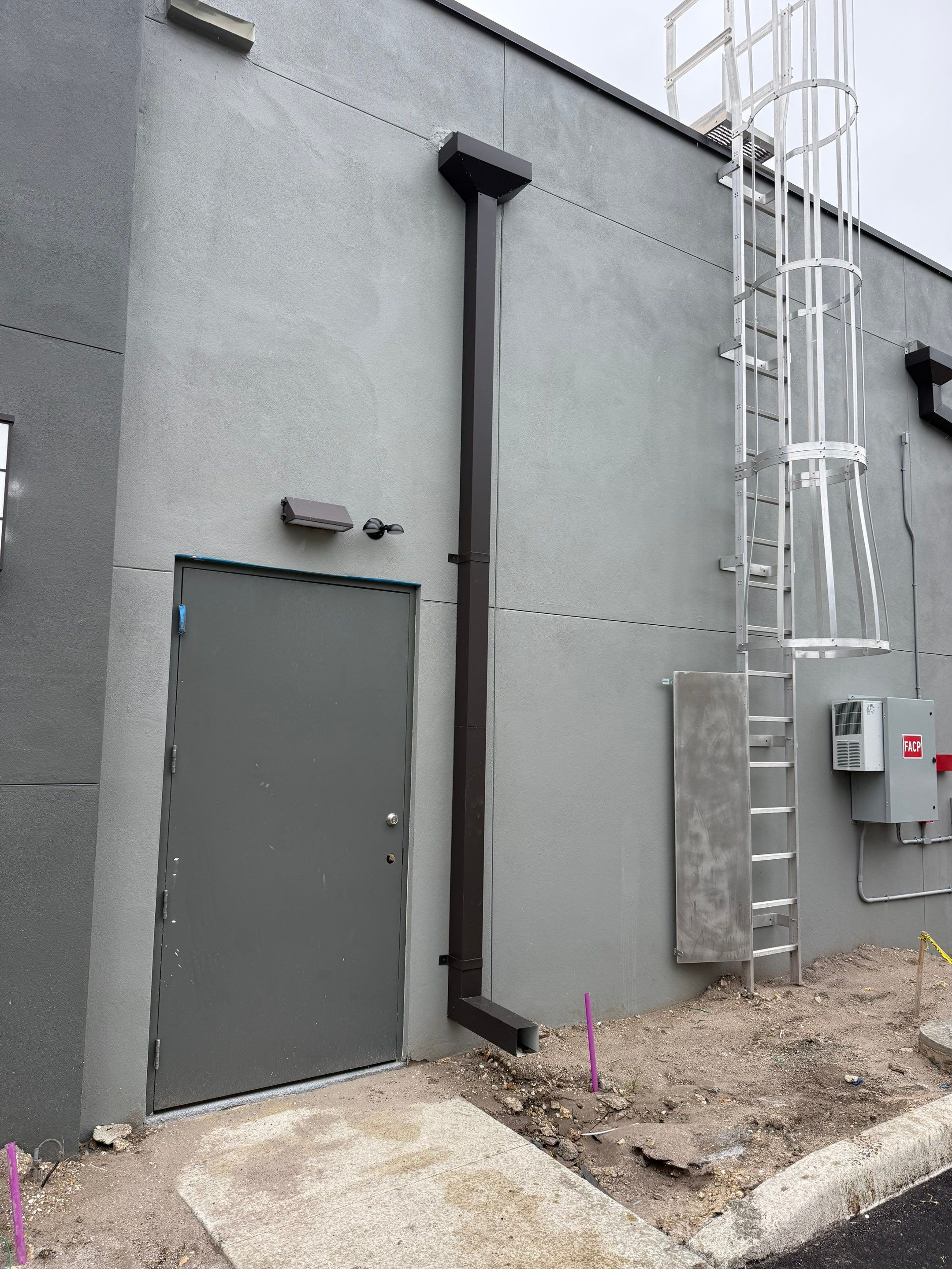 Downspout Installation using collector head in Cape Coral FL by Gutter Professors