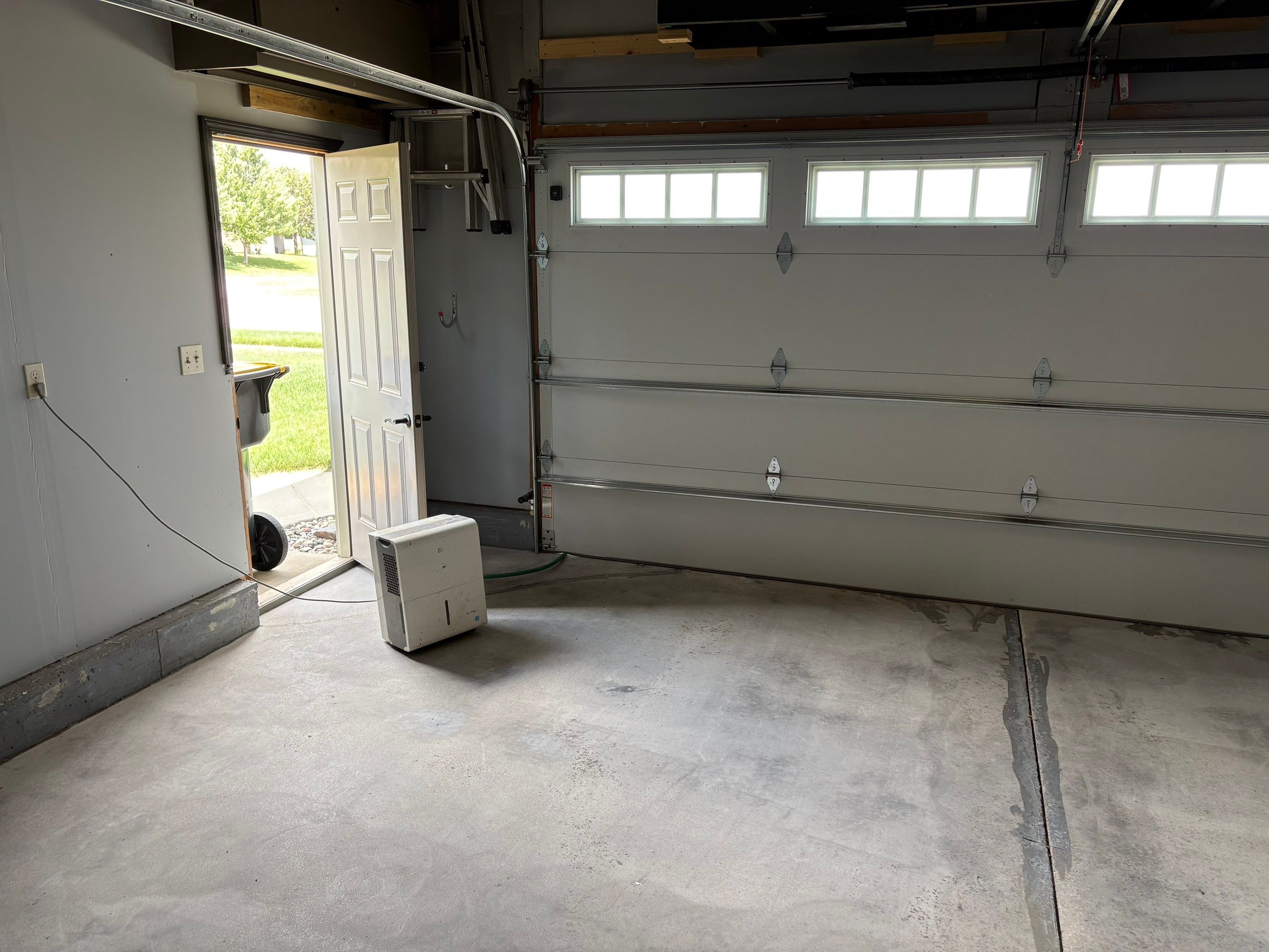 Sioux Falls Garage Concrete Coating Installation with Domino Flake by Select Painting, Coatings & Garage Cabinets