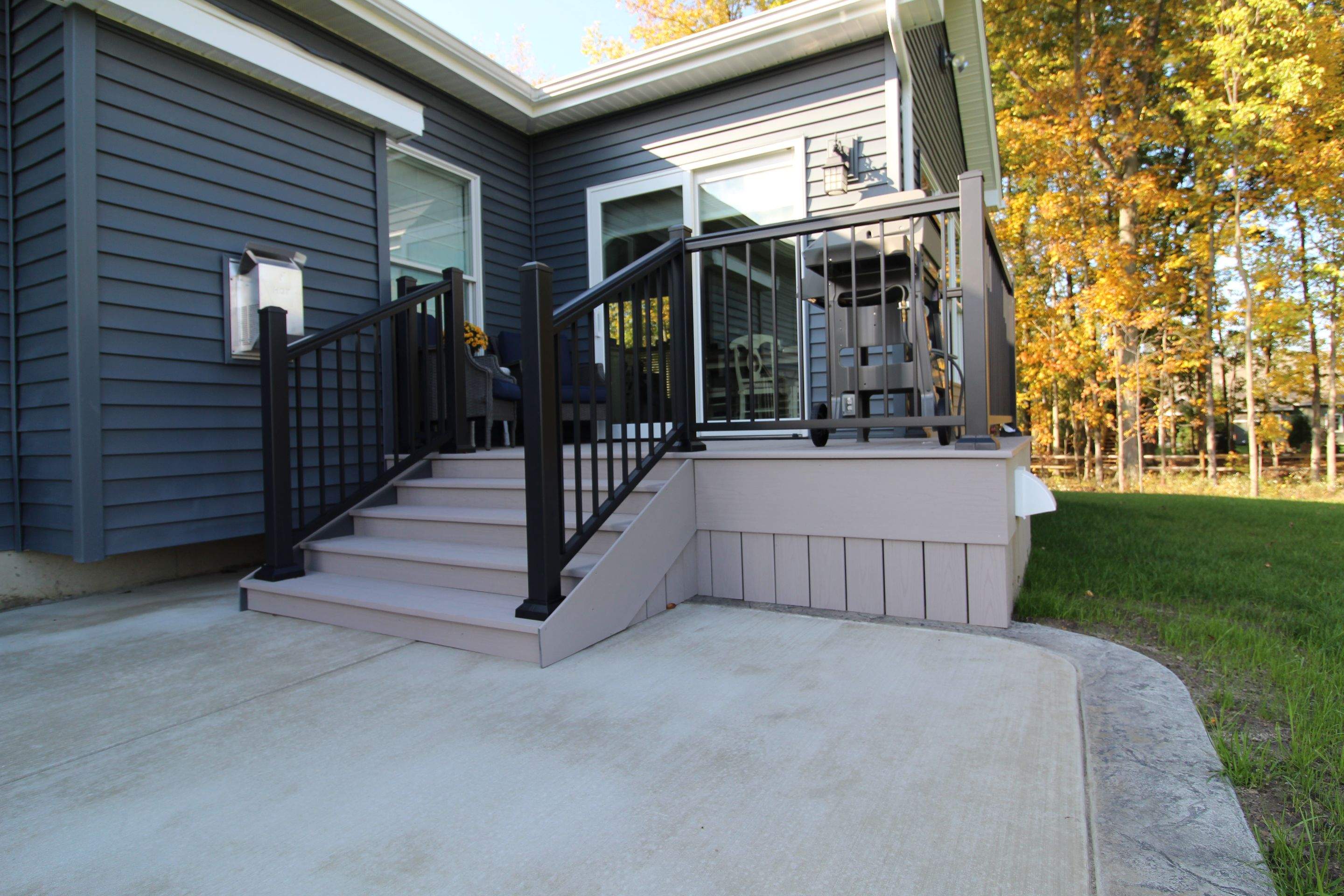 Outdoor Living- Deck and Concrete by Ivy Lea Construction