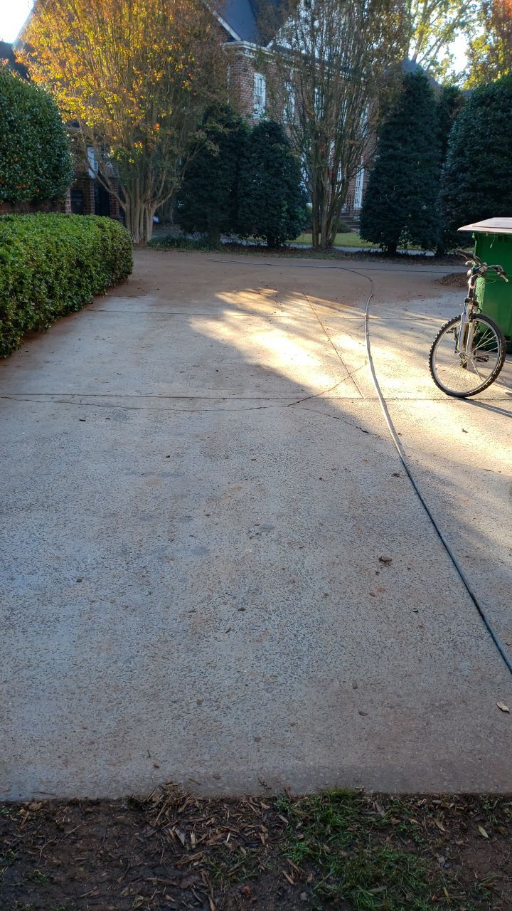 Driveway Clean using cleaner by Power Wash Masters LLC