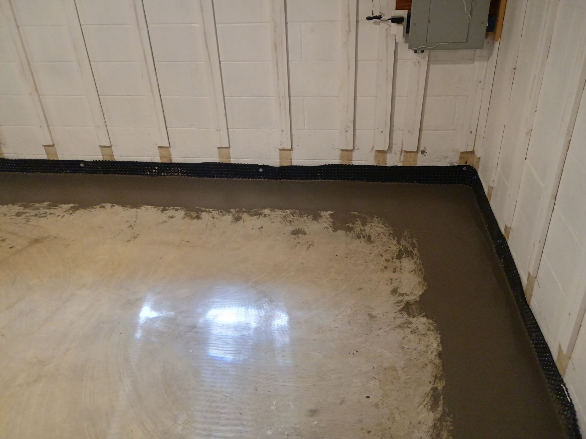Interior Drain Tile & Buried Discharge in St. Anthony, MN by Waterproofing Northeast