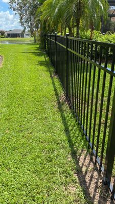 Aluminum Fence Installation using Black 3 Rail Aluminum Fence