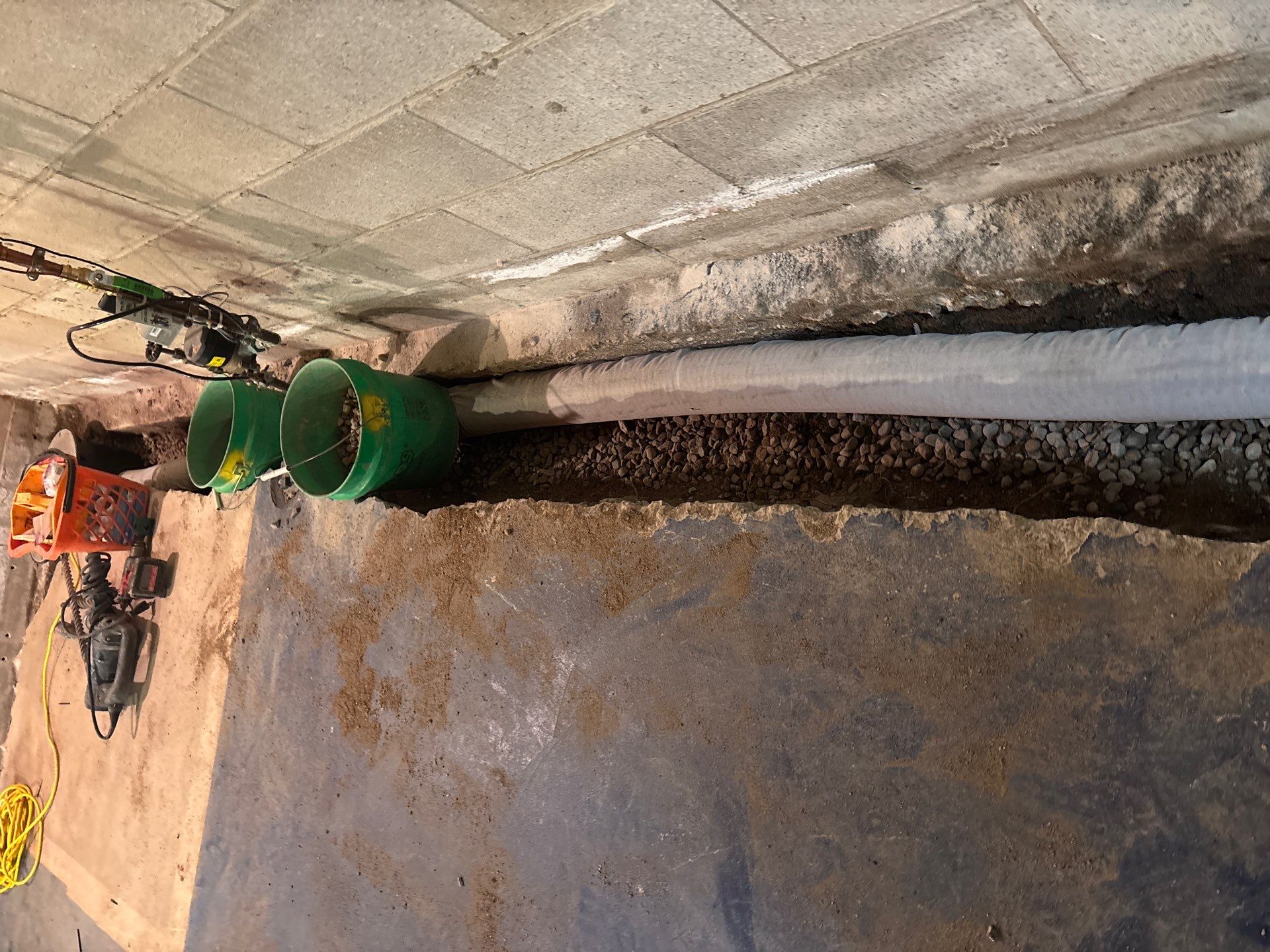Interior Drain Tile & Buried Discharge in South Minneapolis by Waterproofing Northeast