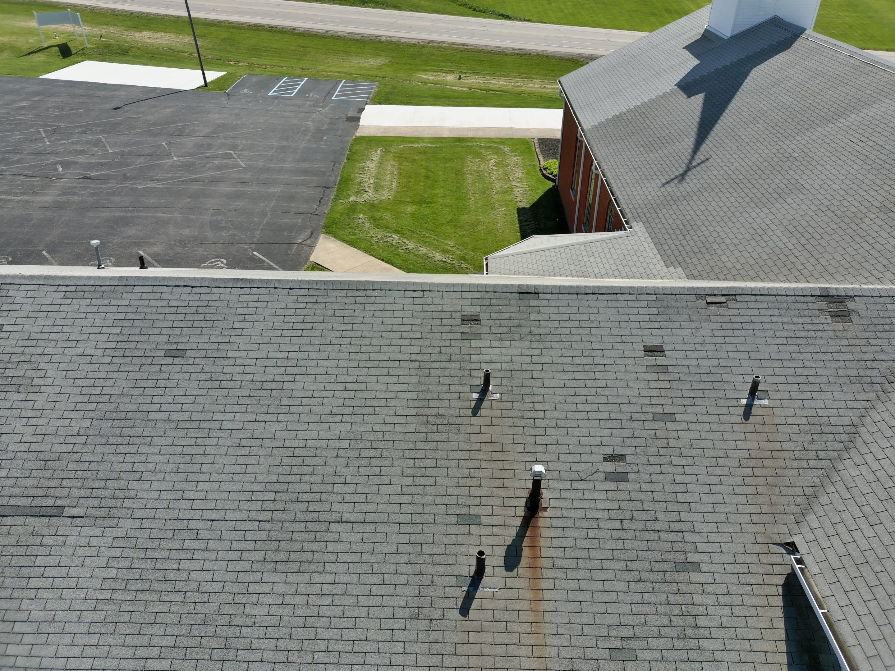 Commercial Roofing Installation using Performance Shingles by Mr. Roofer