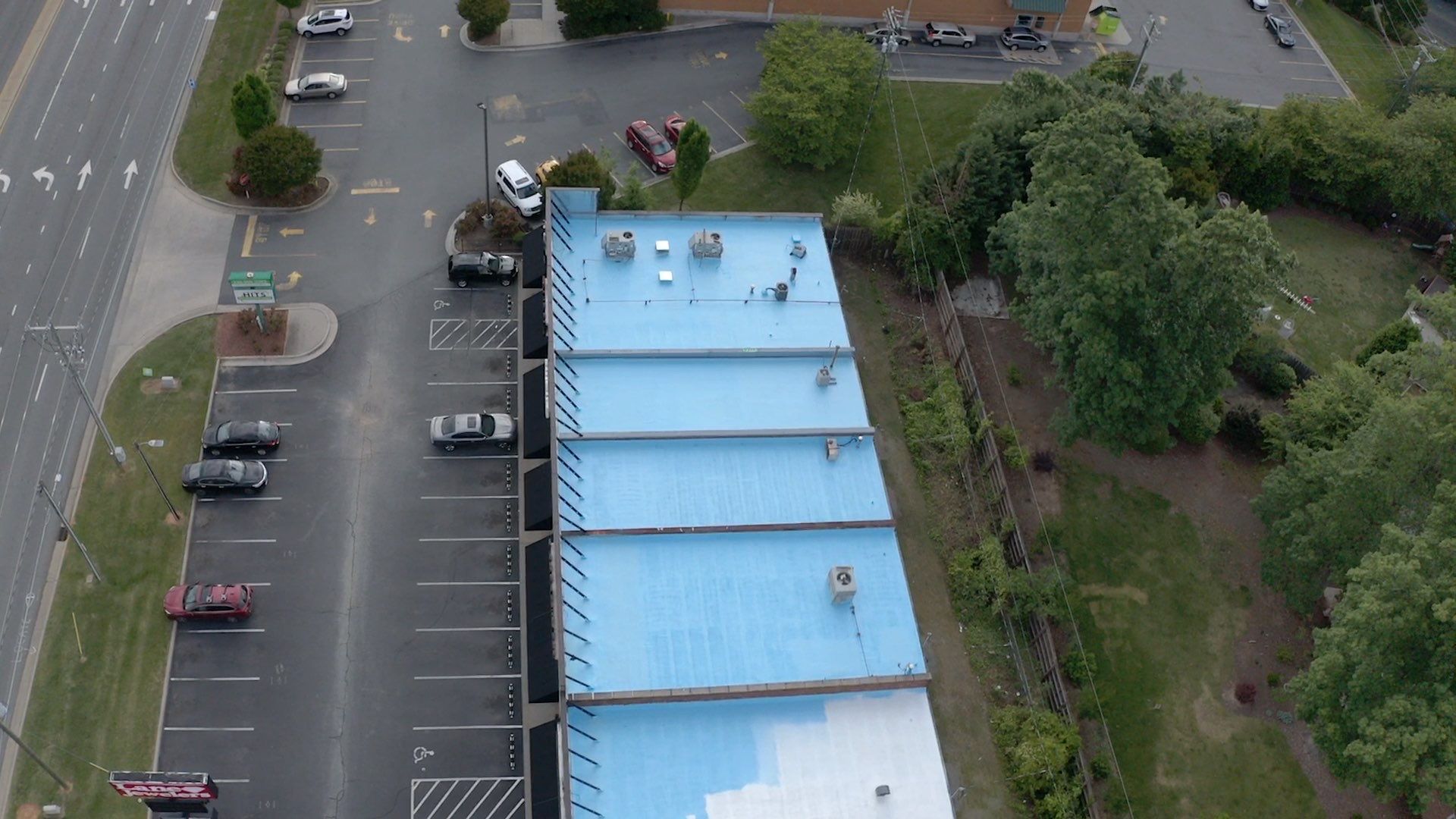 Commercial Roof Coating using Fiberseal basecoat and Silicon Topcoat by Just In Time Roofing and Restoration
