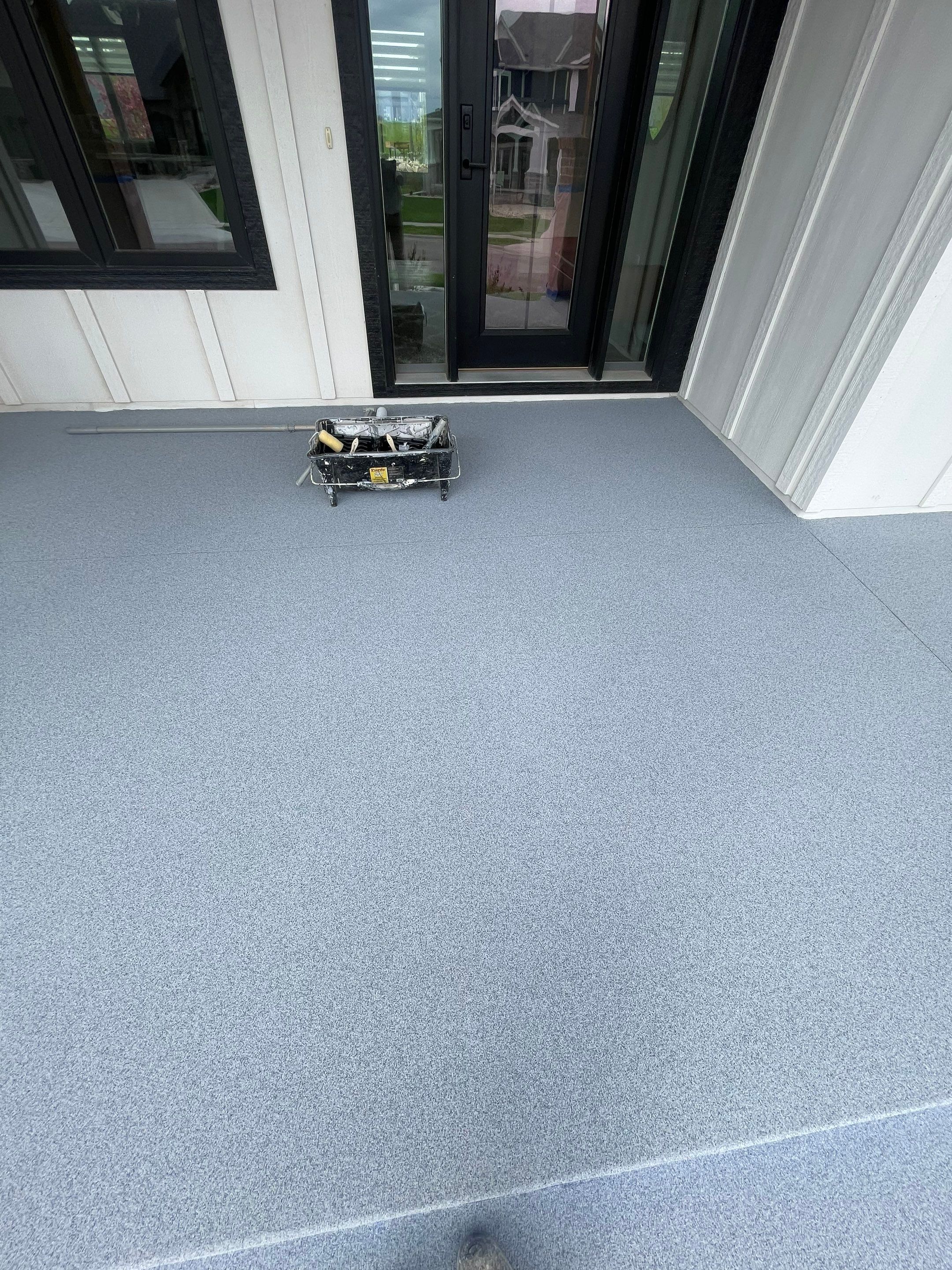 Grey Speckled Concrete Porch Coating for Sioux Falls Home by Select Painting, Coatings & Garage Cabinets