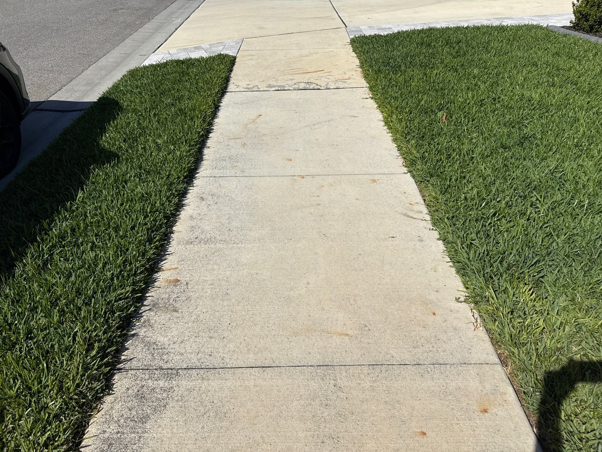 Rust Stain Removal from Concrete Driveway and Pavers in Park East at Azario | Lakewood Ranch, FL by Sunshine AquaWash