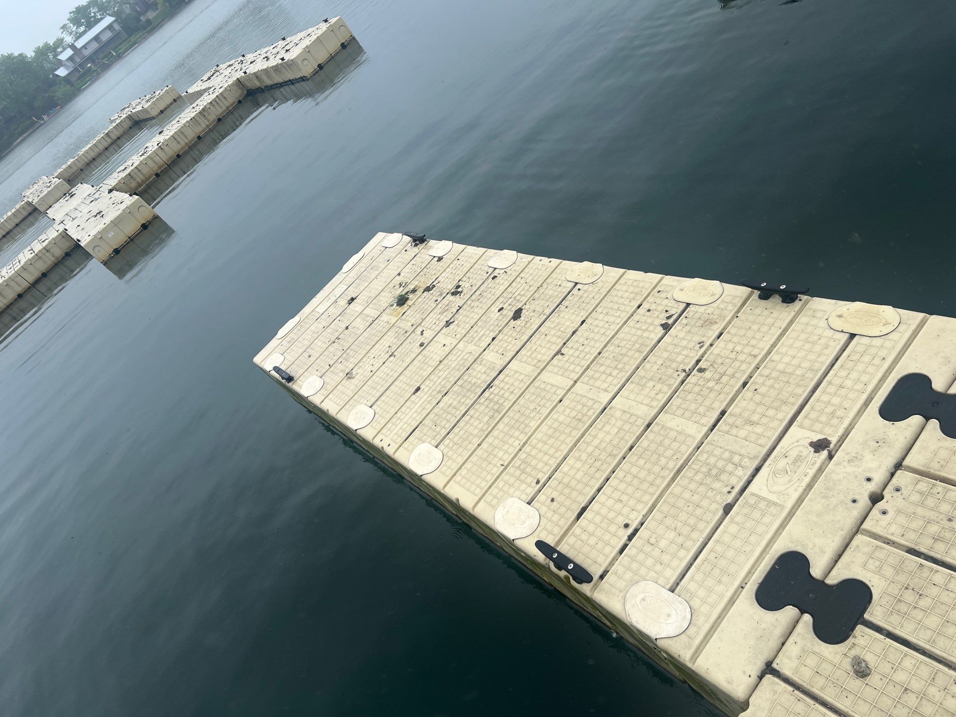 Power washing of floating dock by Northern Power Washing LLC.