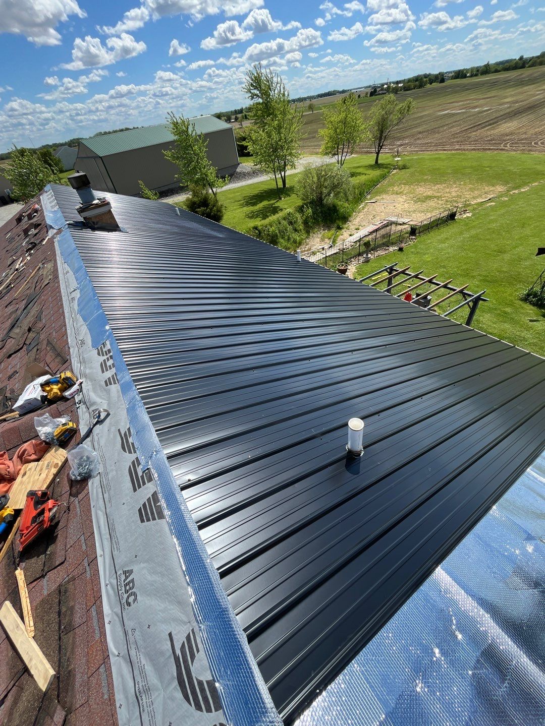 Residential Roofing Installation using Perfromance Panel Metal - Black by RoofX 