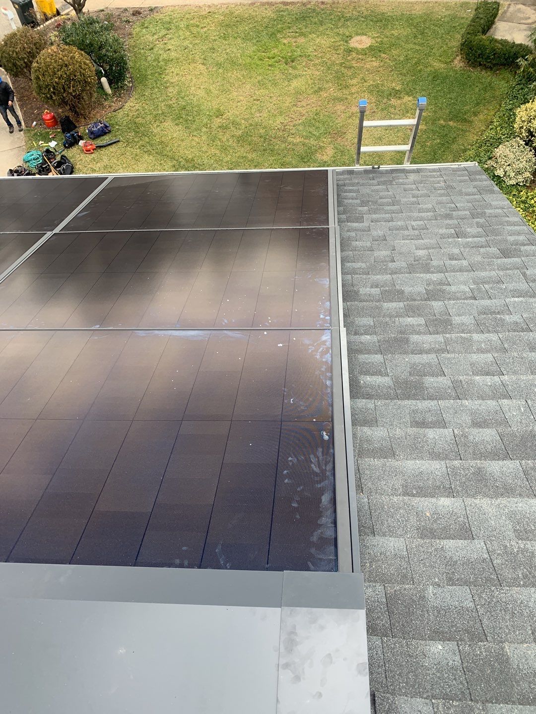 Roof Replacement with GAF Decotech integrated solar panels by American Home Contractors