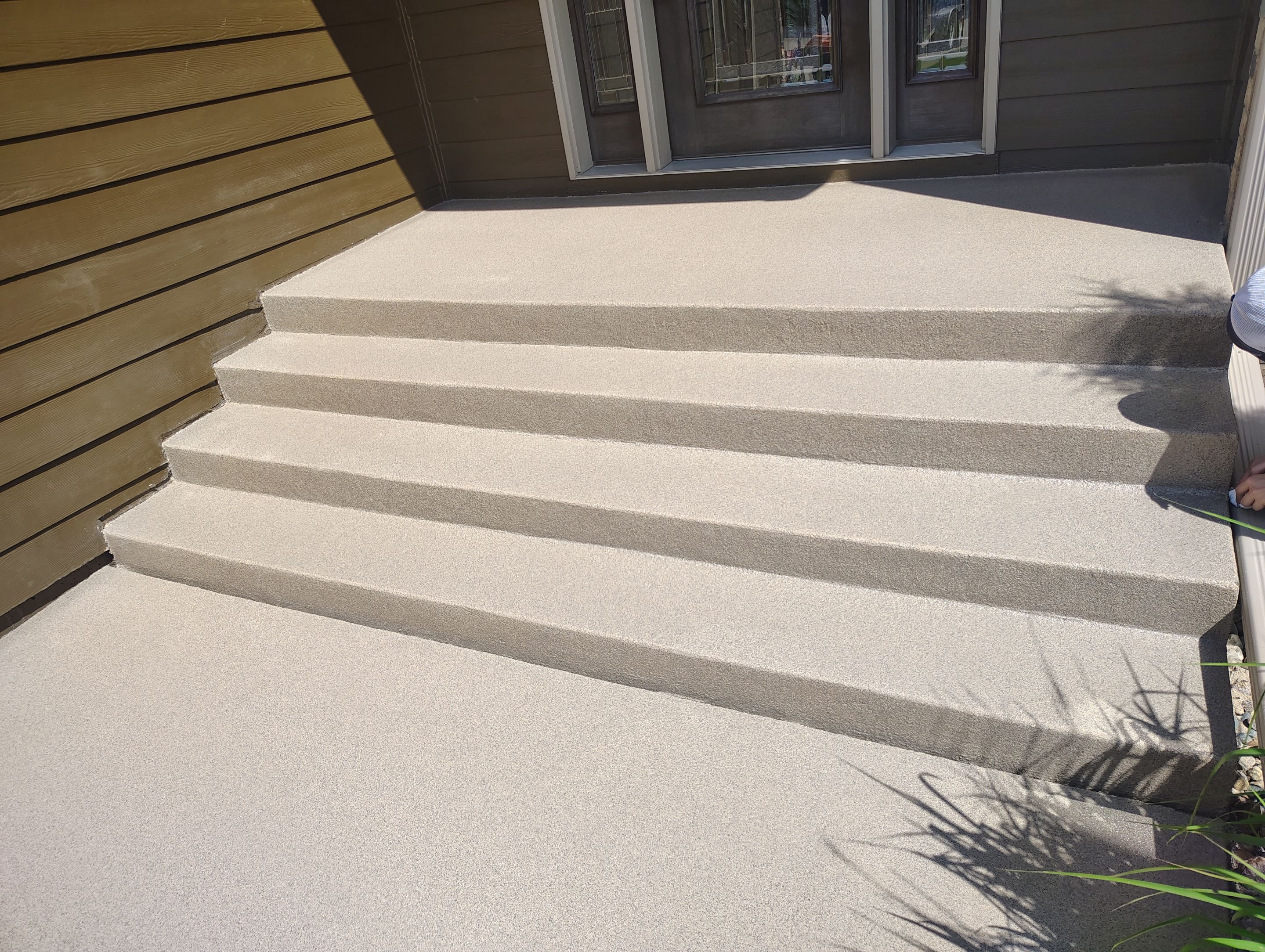 Textured Concrete Coating and Entryway Restoration in Madison by Select Painting, Coatings & Garage Cabinets