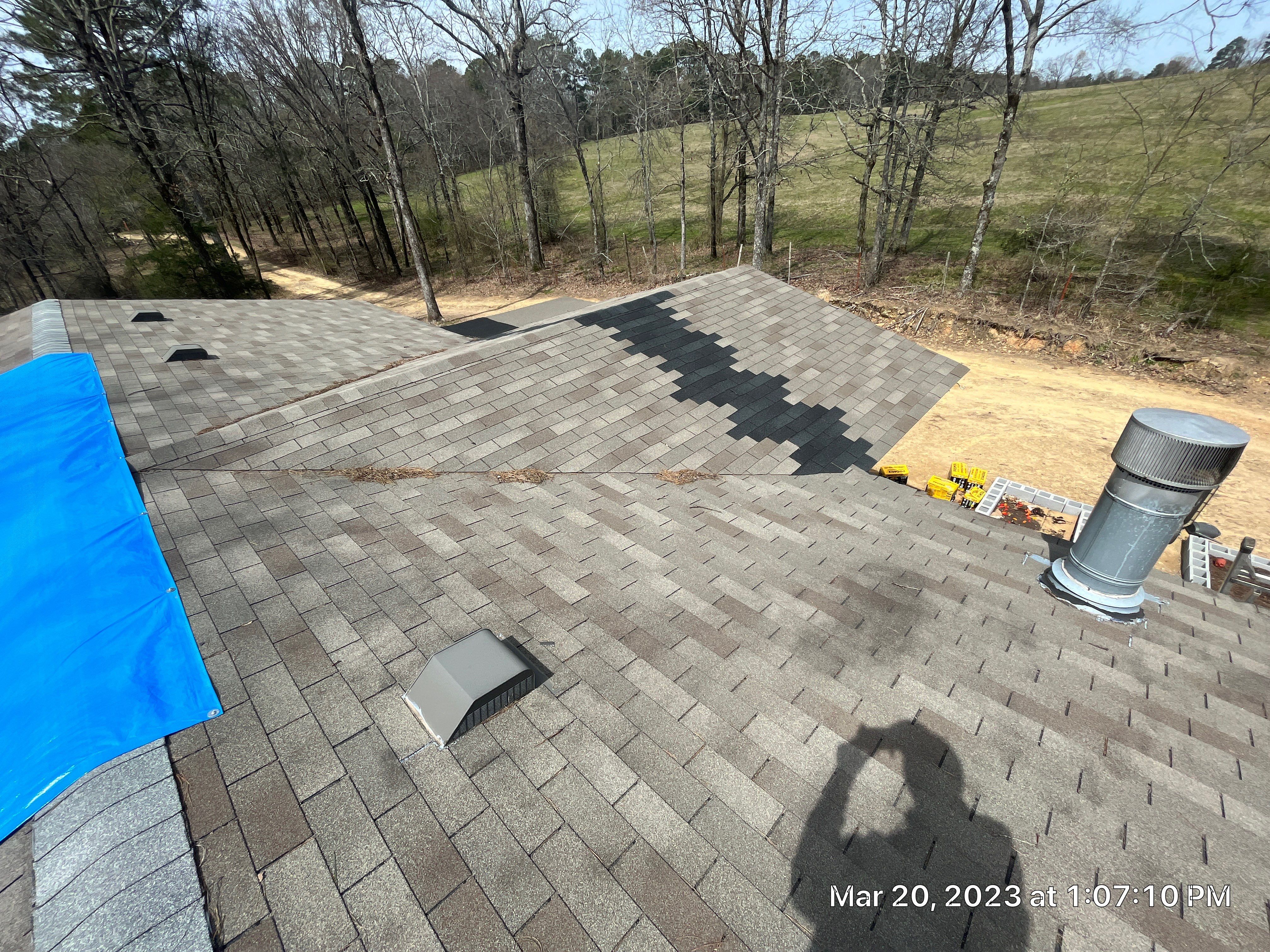Residential Roofing Installation using 26 Gauge Colored Panels by Hostetler Roofing