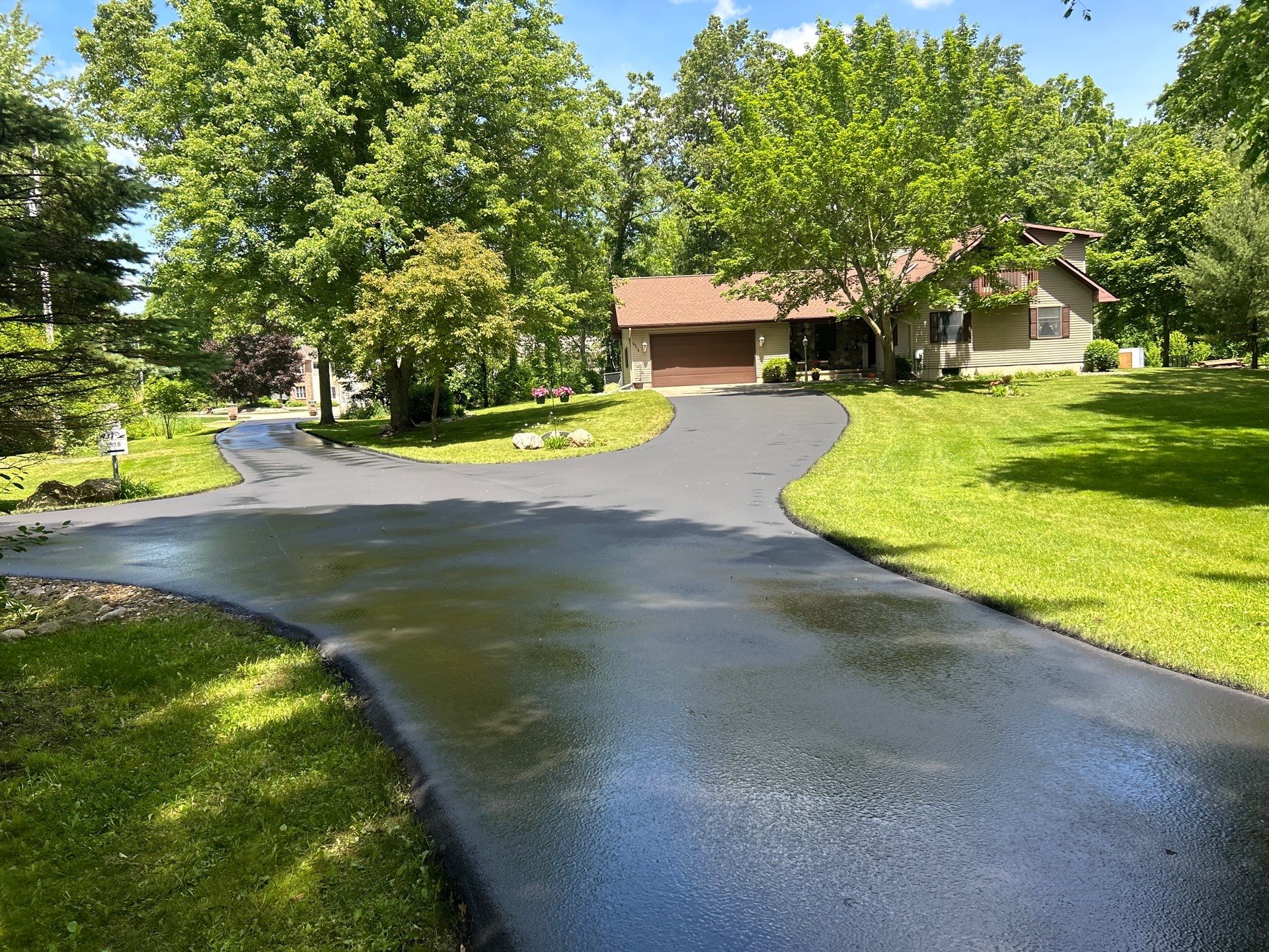 High end residential driveway by Quality Asphalt & Maintenance LLC