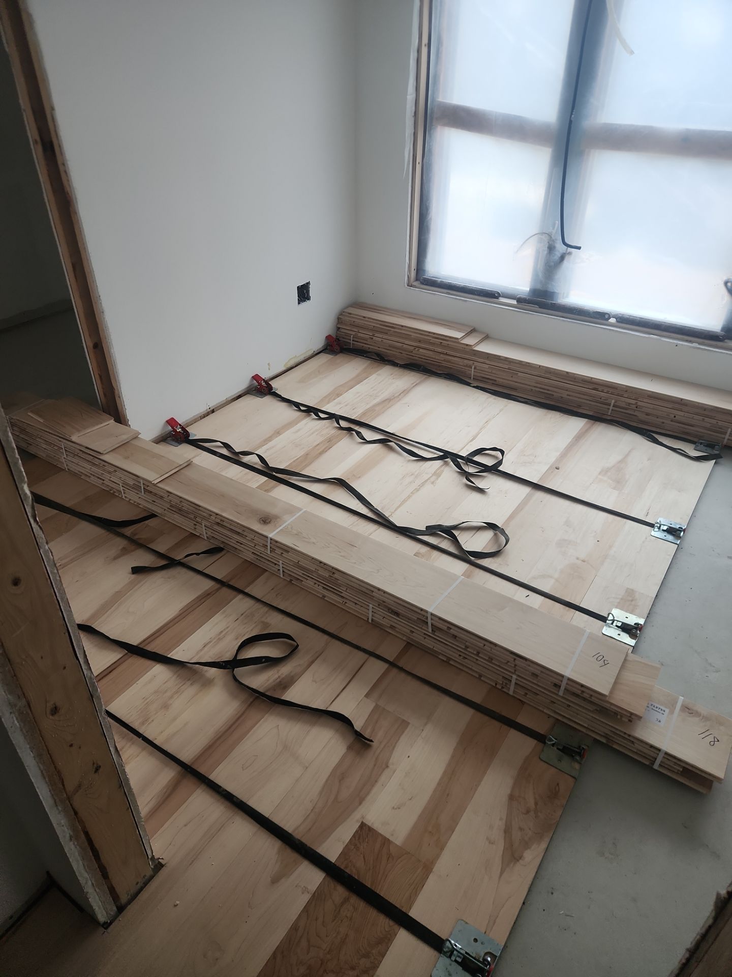 Full glue down Installation over radiant heat 7" Maple character grade by Ann Arbor Hardwoods 