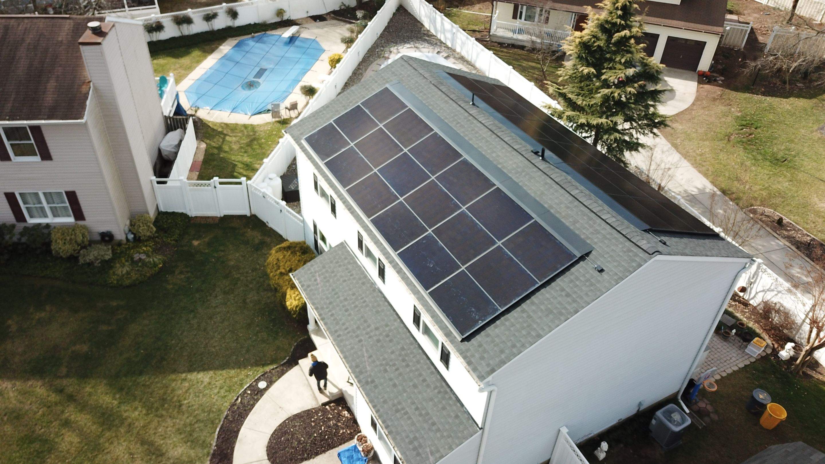 Roof Replacement with GAF Decotech integrated solar panels by American Home Contractors