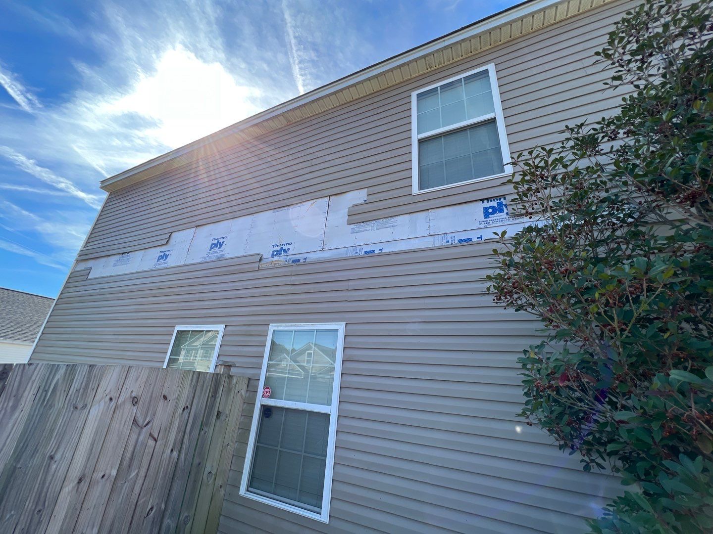Replaced Wind Damaged Vinyl Siding by Midlands Roofing & Exteriors
