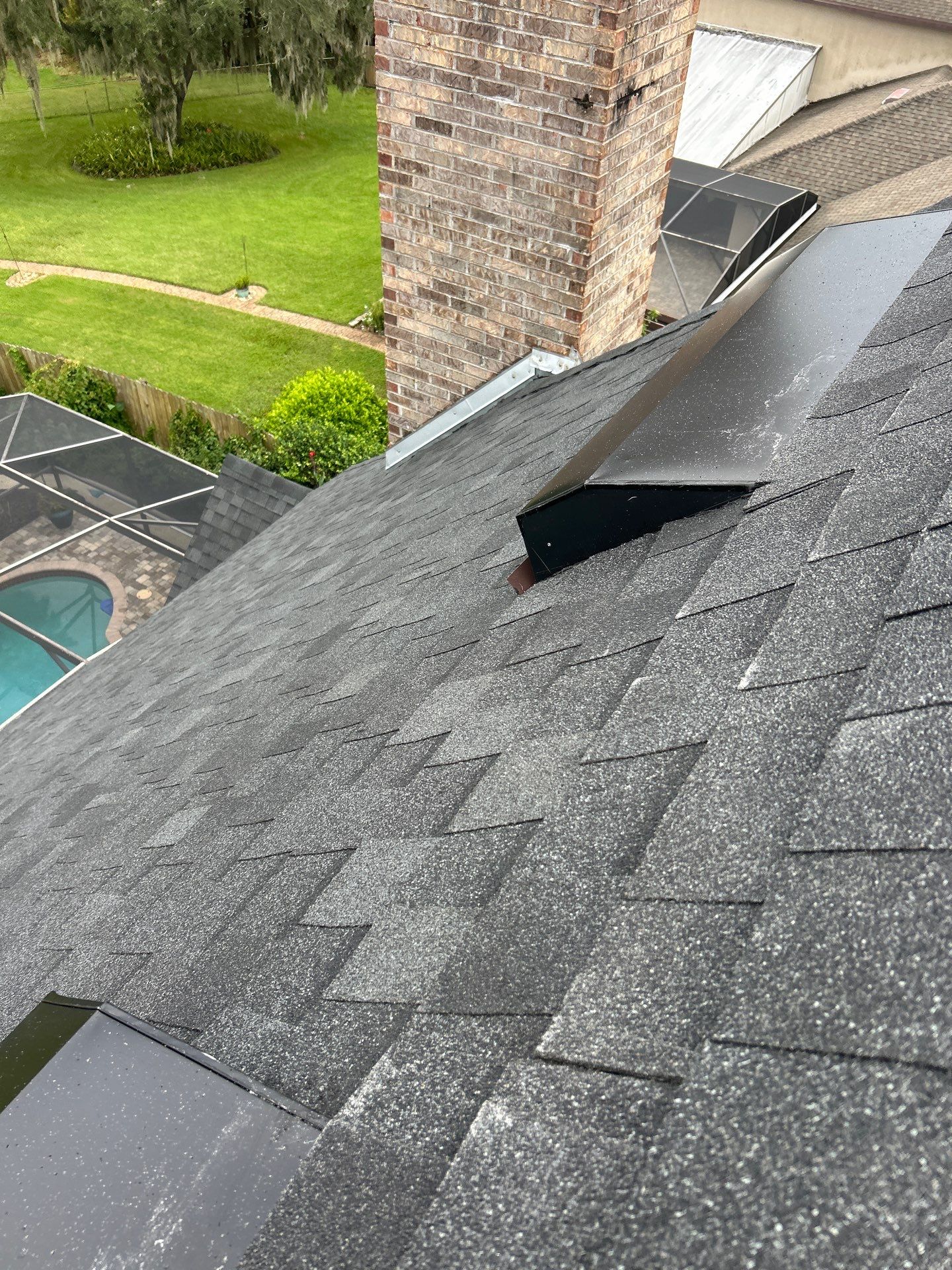 Residential Roofing Installation with Black Shadow Shingles in Clermont by Pinnacle Roofing Group