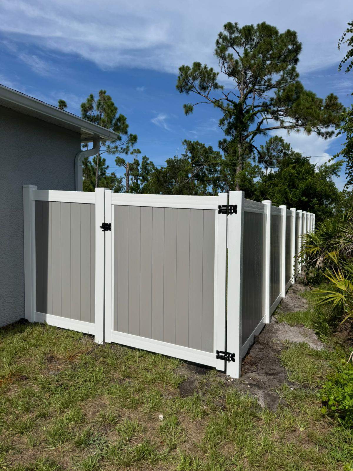 Two-Tone Vinyl Privacy Fence Installation in Port Charlotte by True Fence LLC