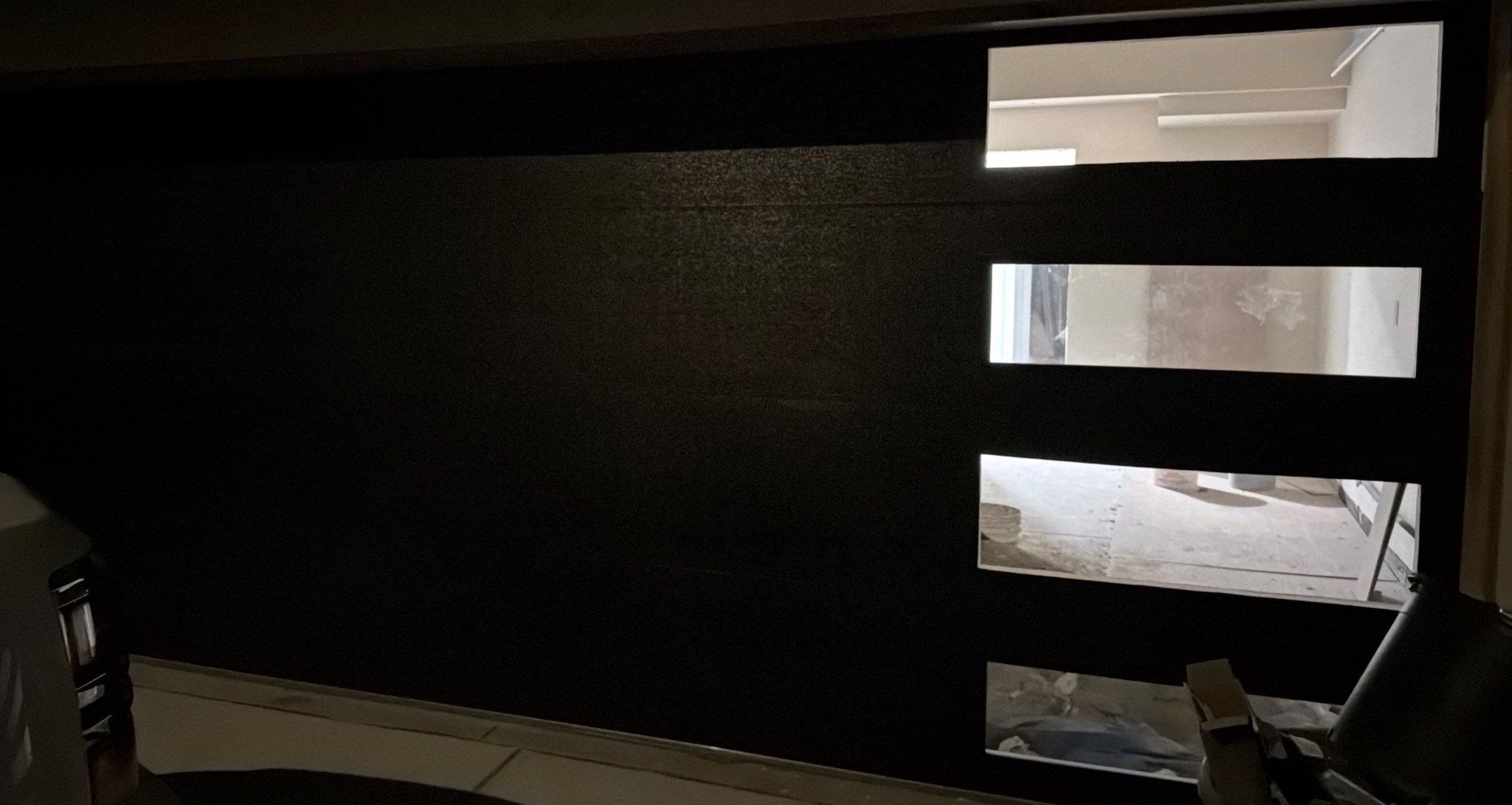 Modern Black Garage Door Installation With Vertical Windows In Cupertino by Valiant Garage Door