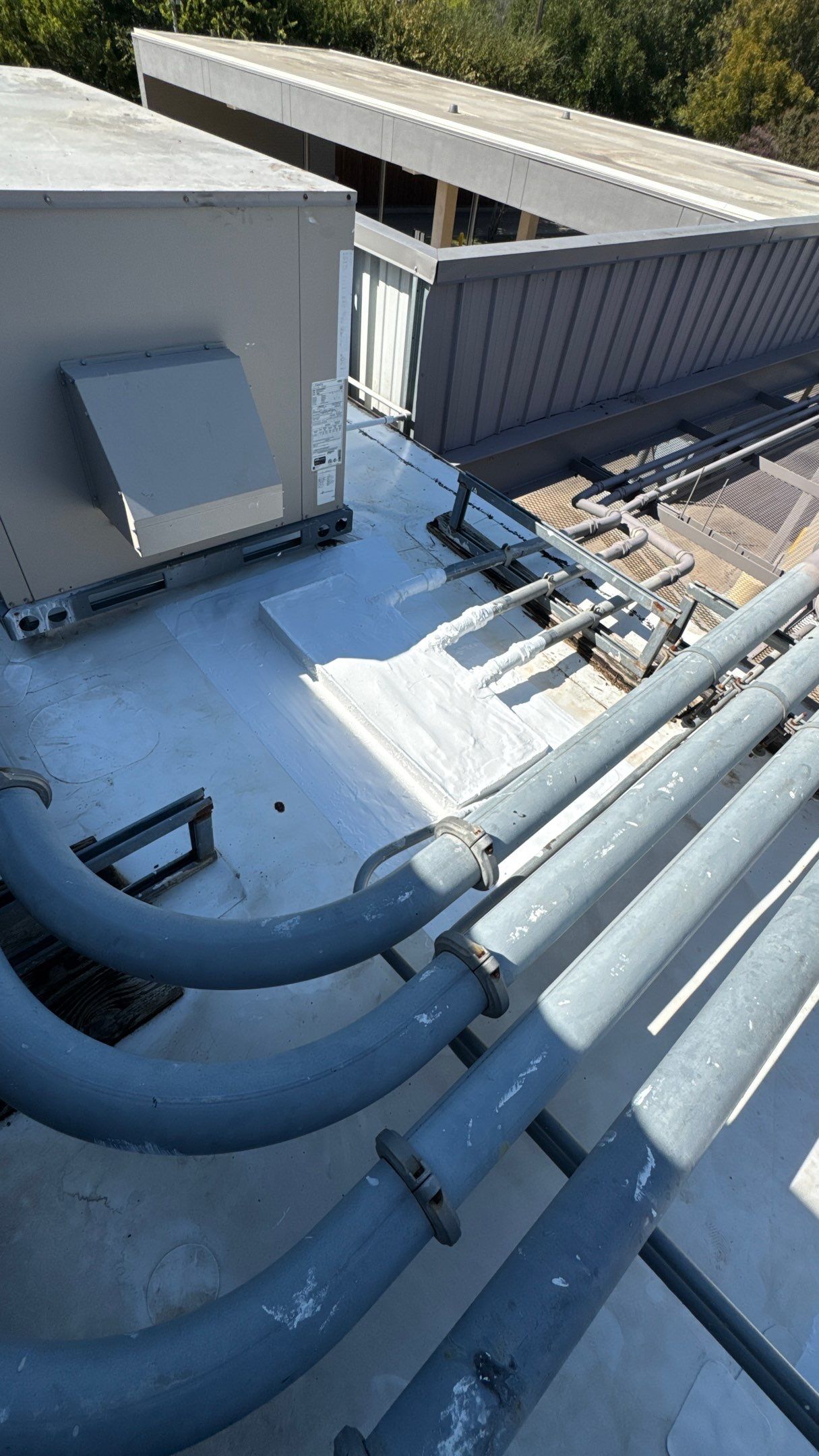 Commercial Roofing Repair using TRP #924 Eterna-Sil Premium Silicone Roof Coating by Harvey Roofing & Construction