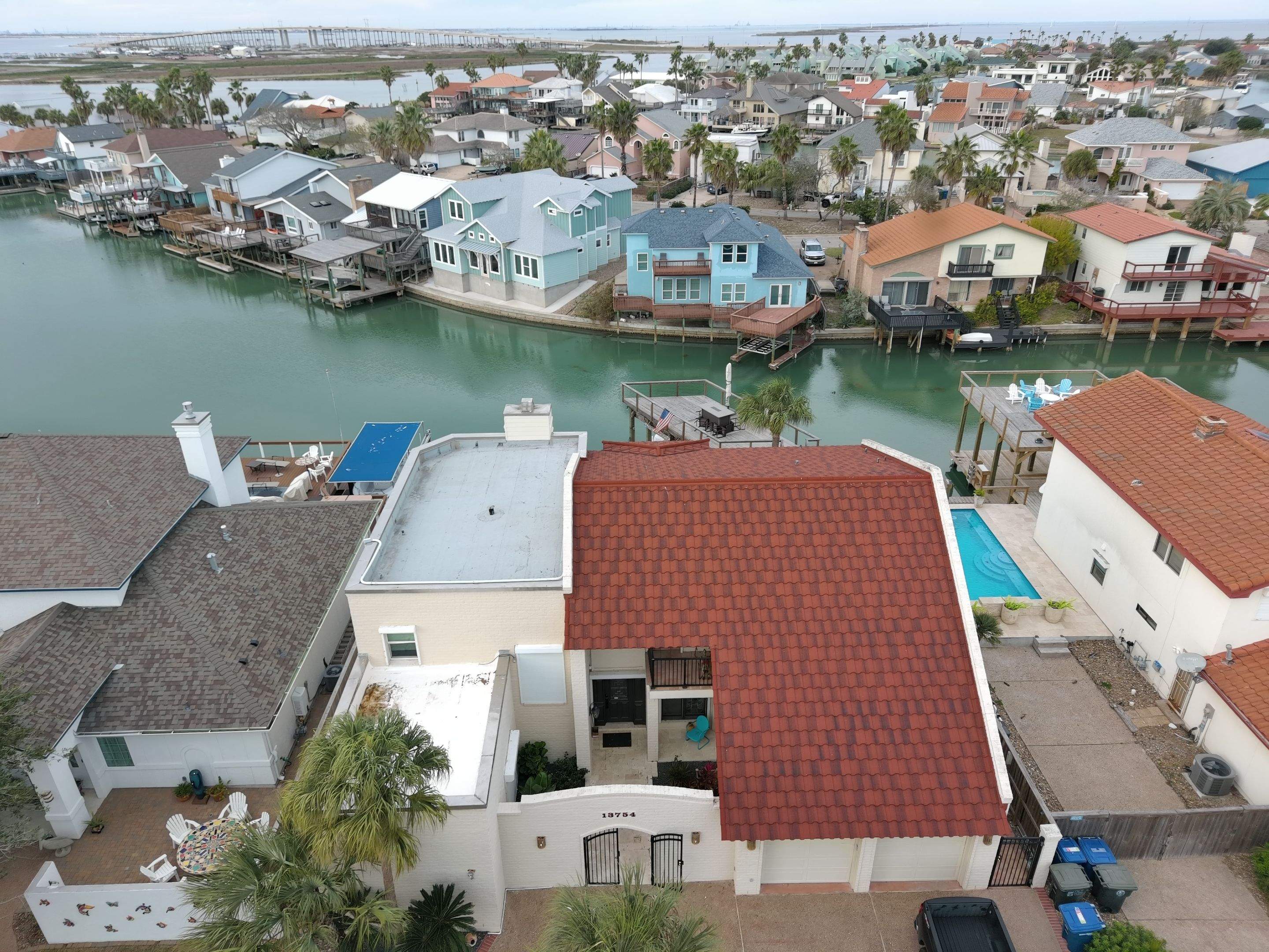 Off with the Tile and on with the TILCOR stone coated metal.  by Bayfront Roofing and Construction