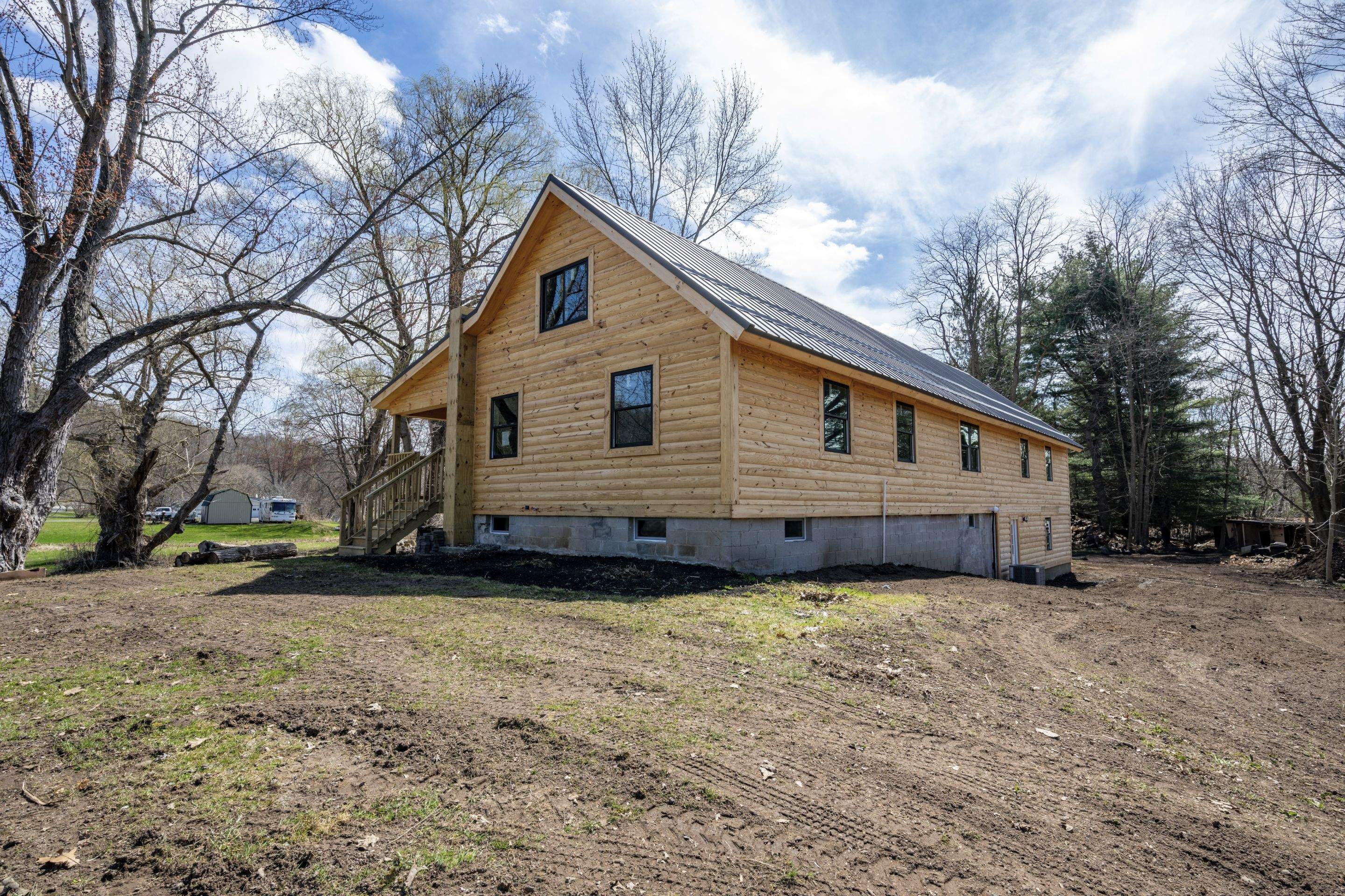 New Addition to Home using Log Cabin Siding  by Horst Custom Homes 