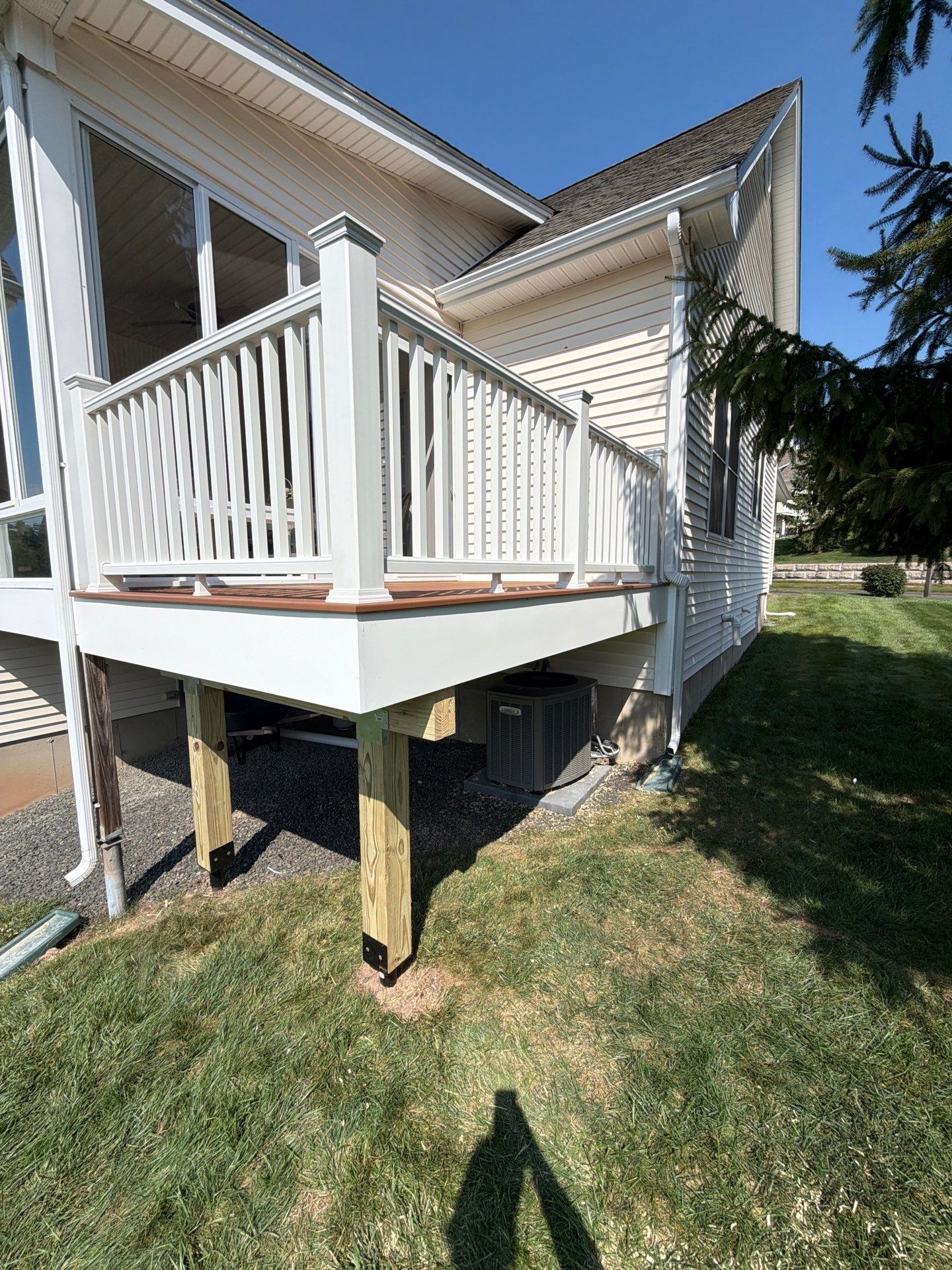 New Trex Deck, Tiki torch boards with Transcend white railings. by DiGiorgi Roofing and Siding Inc