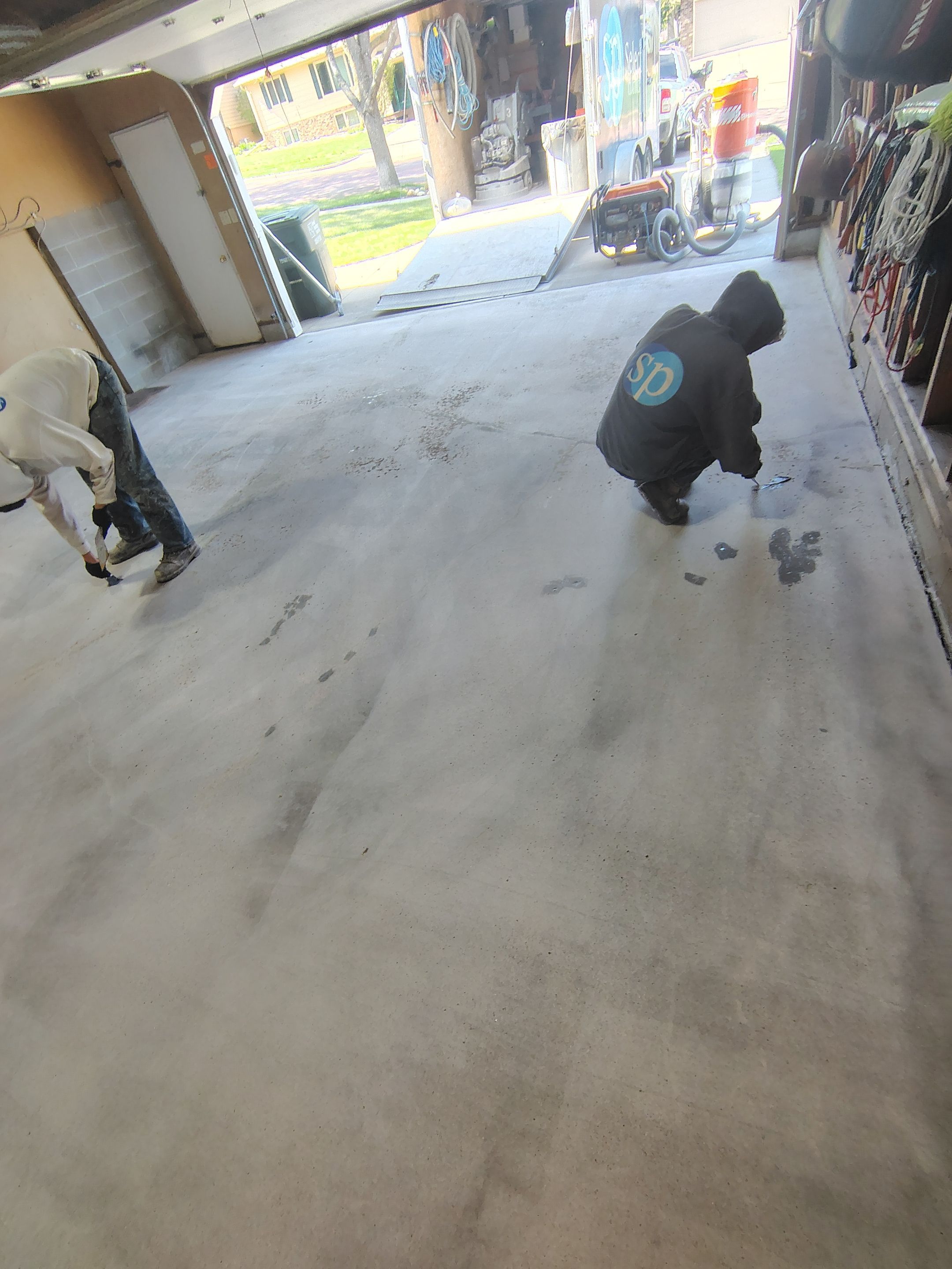 Sioux Falls Garage Epoxy Floor Installation and Concrete Crack Repair by Select Painting, Coatings & Garage Cabinets
